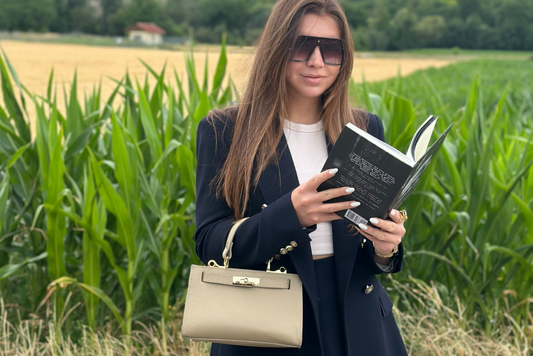 woman with light-colored leather bag