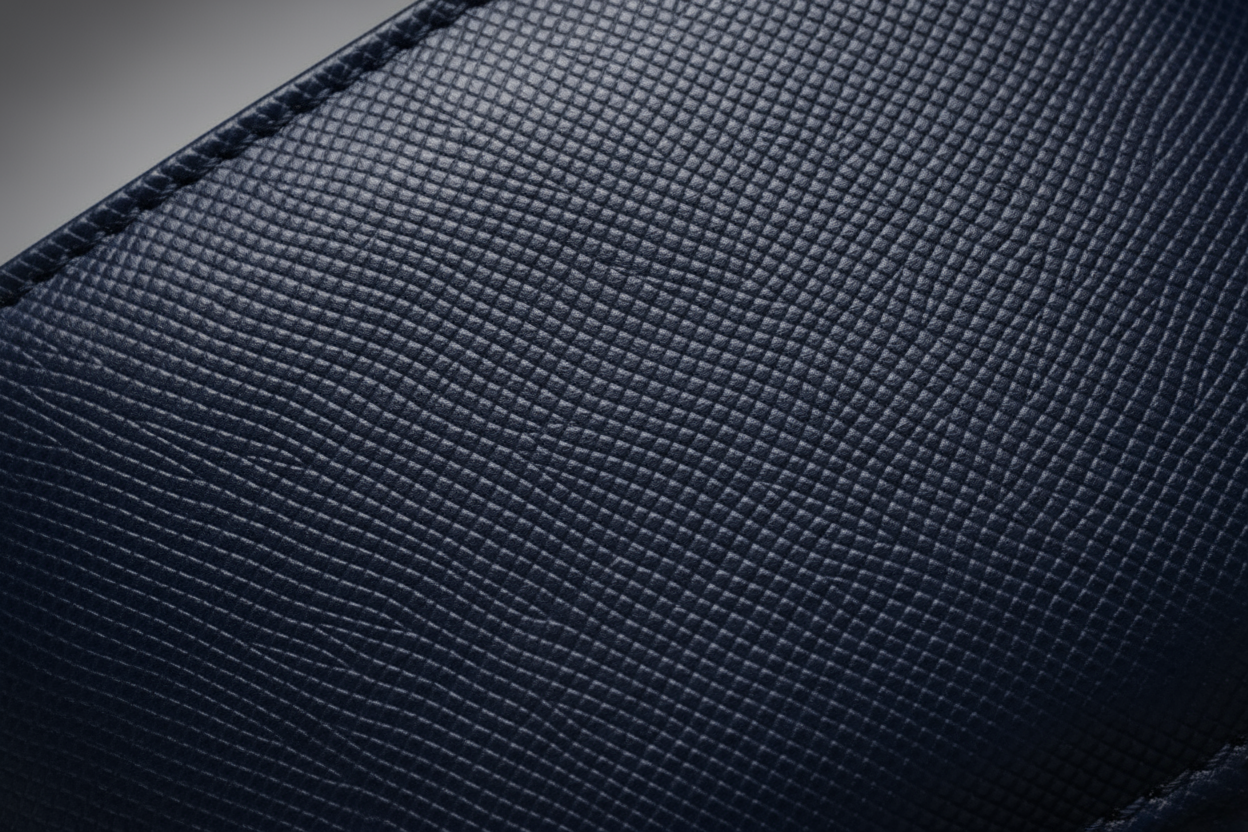 Embossed texture of Saffiano leather — example of material we don’t use