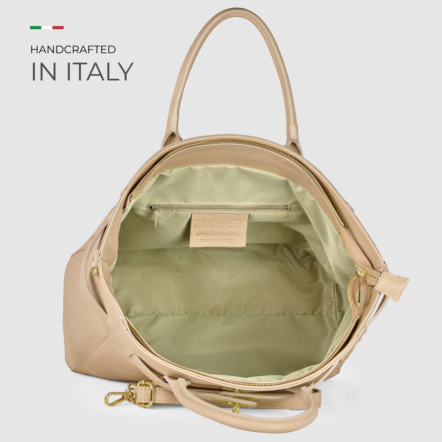 A beige pebbled calf leather handbag with gold hardware, shown open to reveal a spacious light green fabric interior and inner pocket. Text reads Handcrafted in Italy with an Italian flag motif—an everyday luxury Italian leather tote bag.