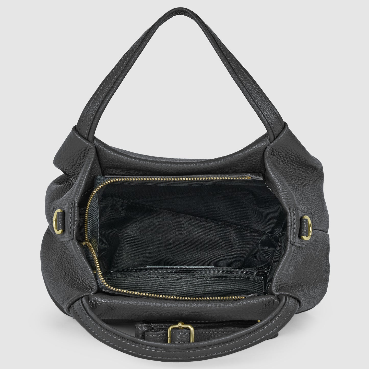 A black Italian leather handbag handcrafted in Italy with gold hardware is open, showing a spacious interior lined with black fabric, inner zippered pocket, and handles on either side.