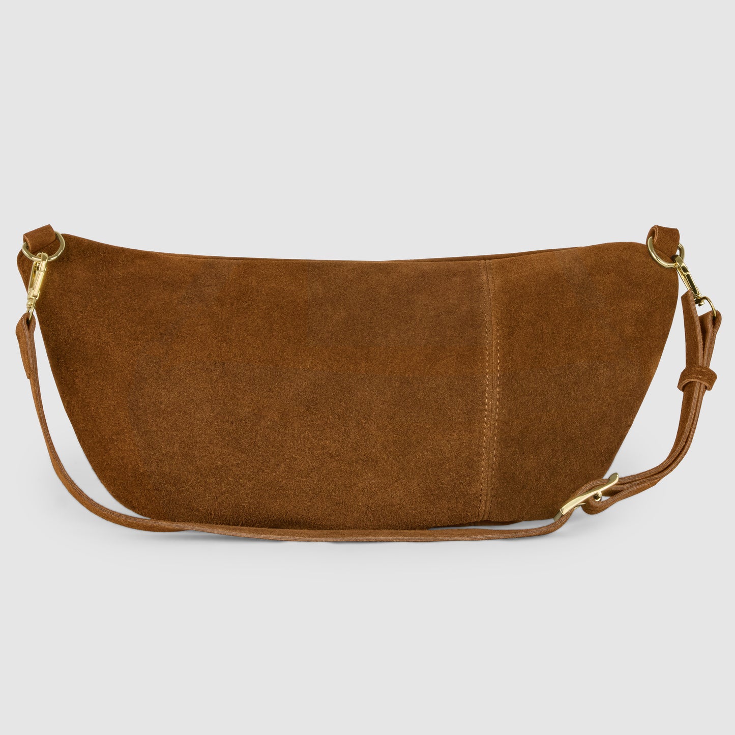 A crescent shape handbag in brown Italian suede with gold hardware and an adjustable strap, displayed against a plain light gray background.