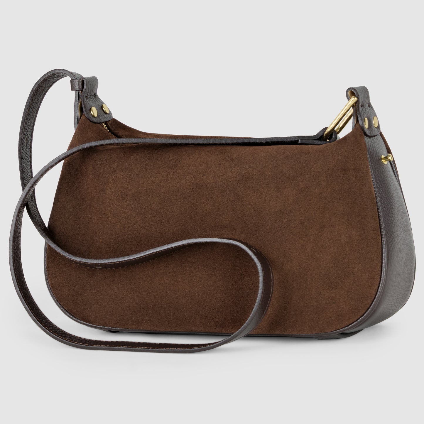 A brown suede Italian leather bag with dark brown leather trim and strap, gold-tone hardware, and a minimalist design showcases Florentine craftsmanship against a plain, light gray background.