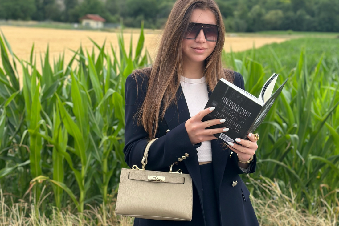 woman with light-colored leather bag