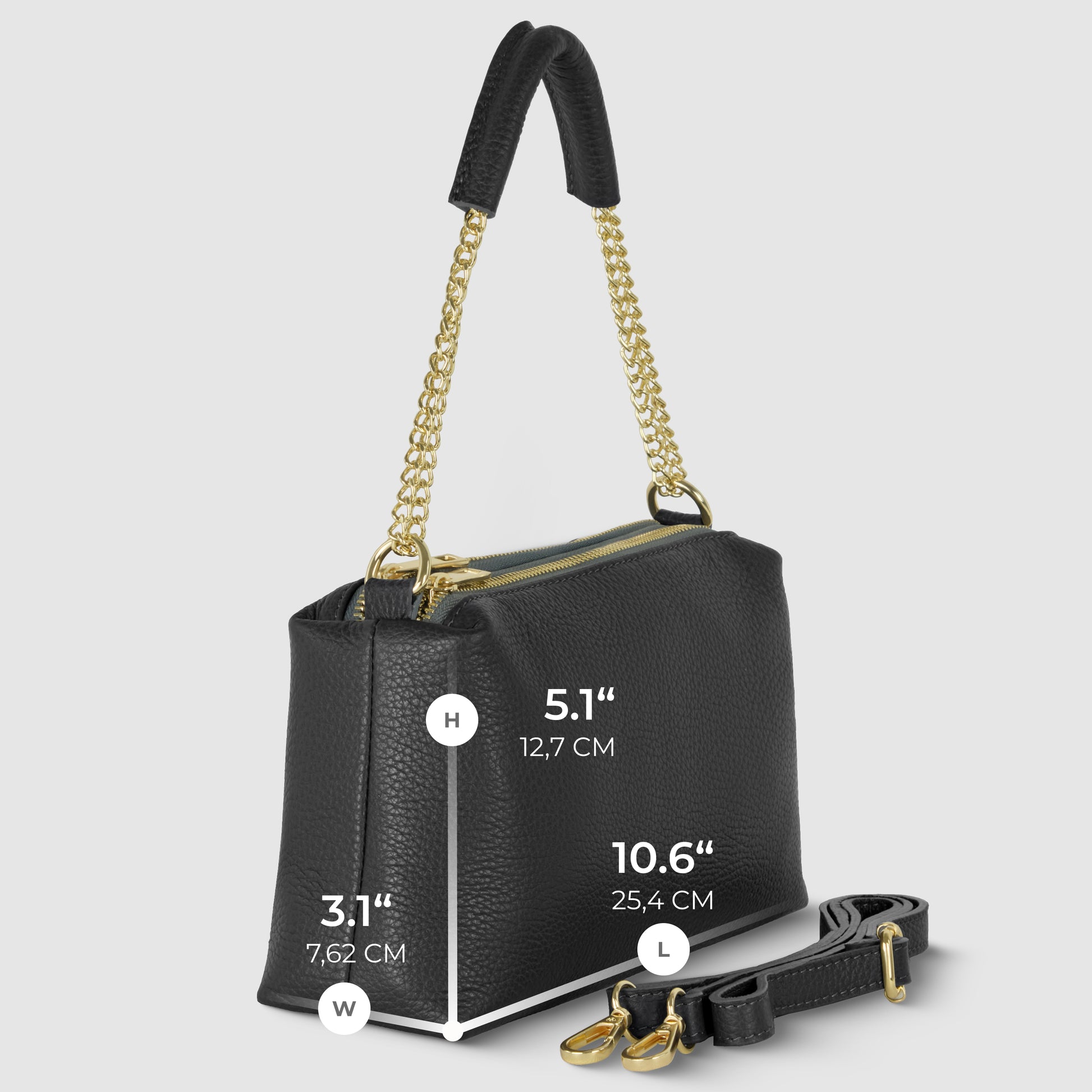 A black textured Italian leather bag with gold chain handles is shown upright. Measurements are labeled: height 5.1 (12.7 cm), width 10.6 (25.4 cm), depth 3.1 (7.62 cm). A detachable strap lies in front for this elegant shoulder bag.