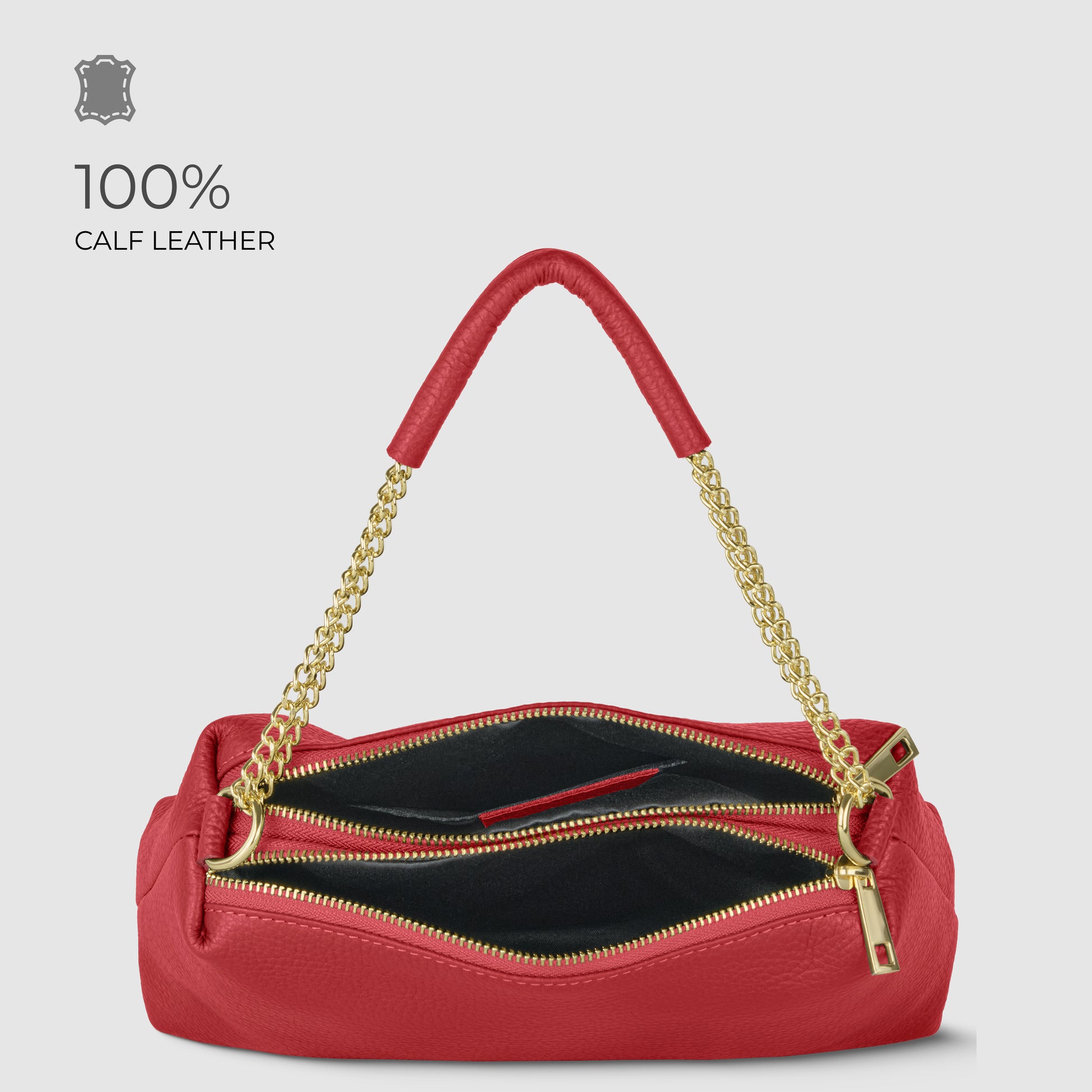 Red leather handbag with gold chain handles, two zippered compartments, and black interior lining. Text on the left reads 100% Calf Leather. This elegant shoulder bag is open, displaying its spacious interior.