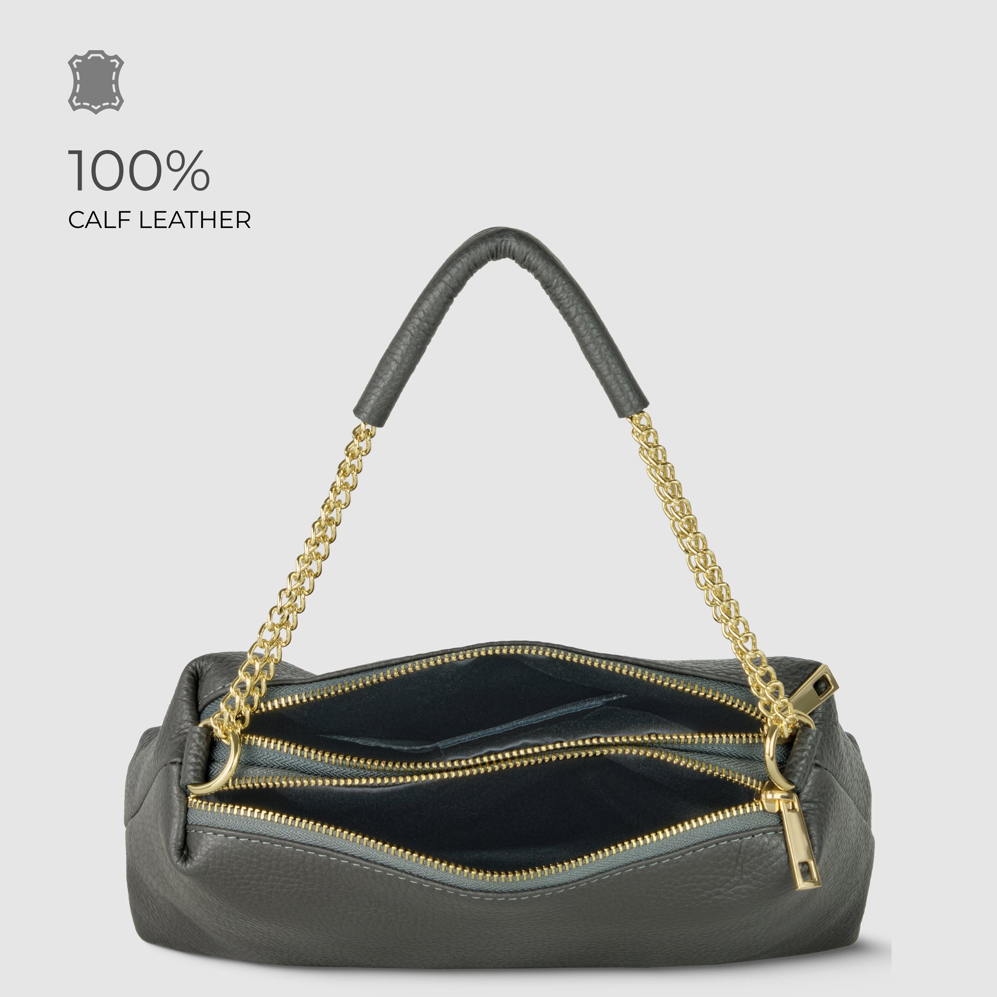 A luxury shoulder bag in dark gray calf leather with gold chain handles and two zippered compartments, shown open to reveal the interior. Text on the image reads “100% CALF LEATHER.”.