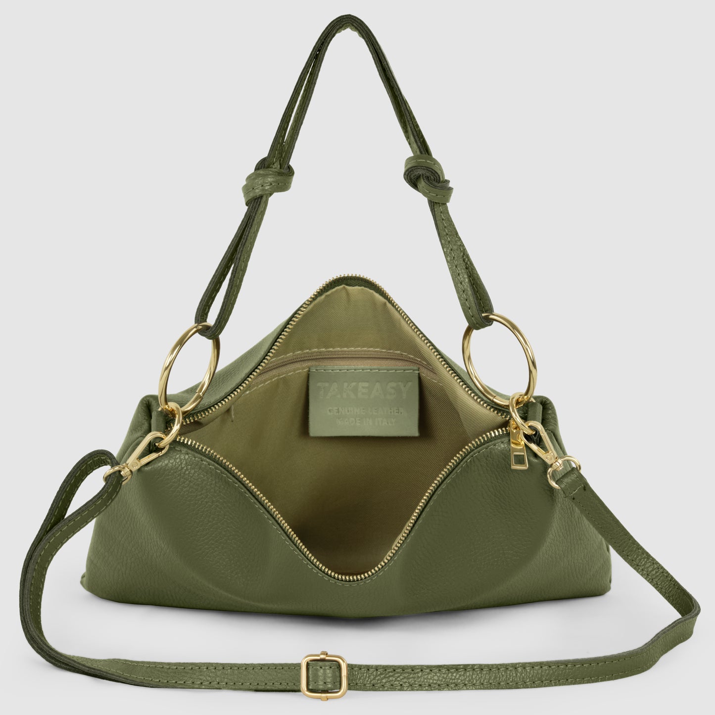An olive green structured zippered purse crafted from real calf leather, with gold hardware, double handles, and a zippered opening, displayed open to reveal the interior lining and a visible label inside.