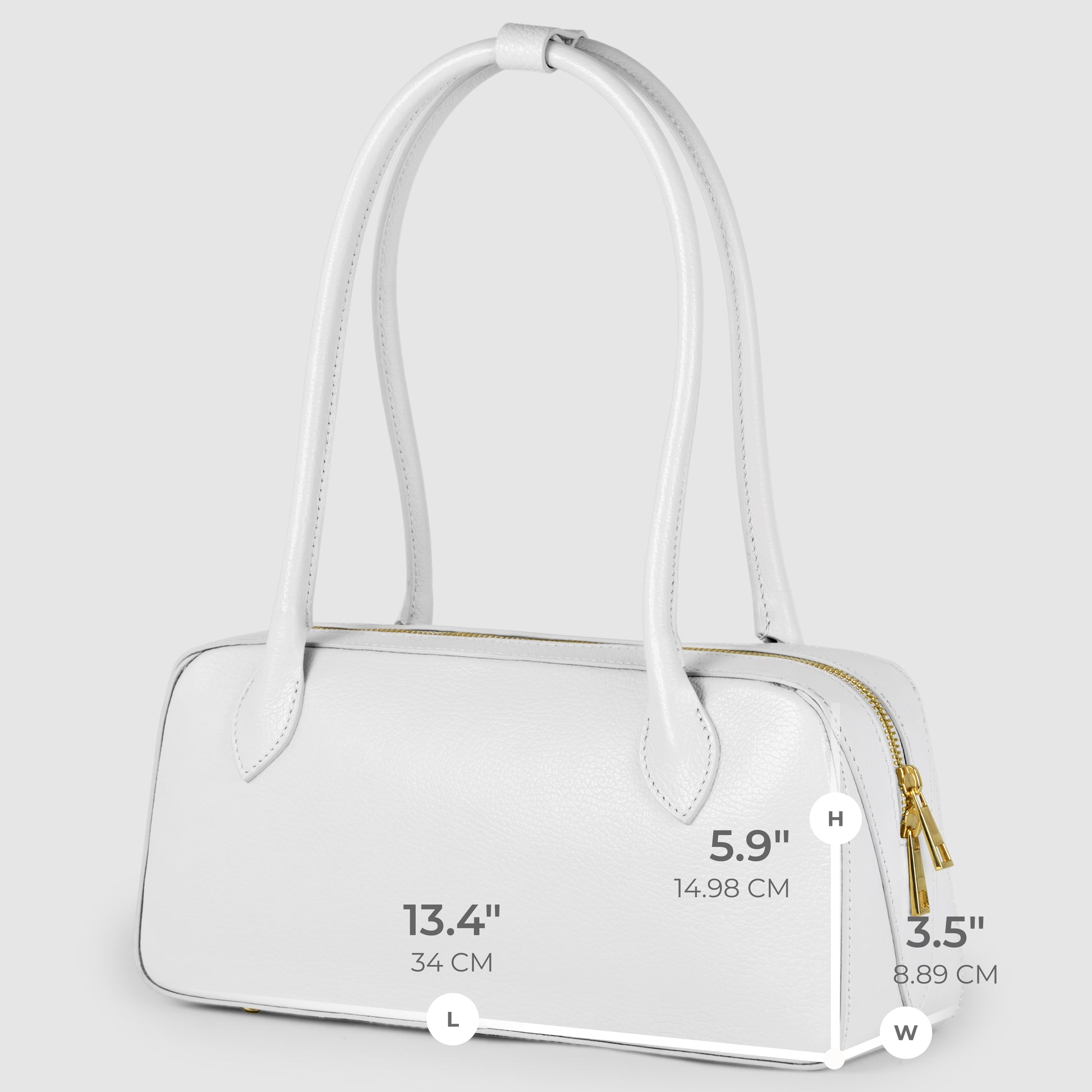 A white rectangular Italian leather bag with two handles, a gold zipper, and dimensions labeled: 13.4 (34 cm) long, 5.9 (14.98 cm) high, and 3.5 (8.89 cm) wide—showcasing elegant Florentine craftsmanship.