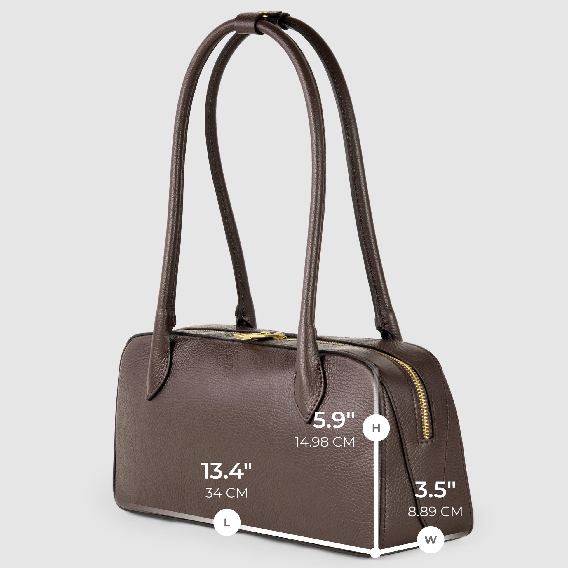 A brown Italian leather bag with two long handles and a gold zipper. Dimensions are length 13.4 inches (34 cm), height 5.9 inches (14.98 cm), and width 3.5 inches (8.89 cm), showcasing exquisite Florentine craftsmanship.