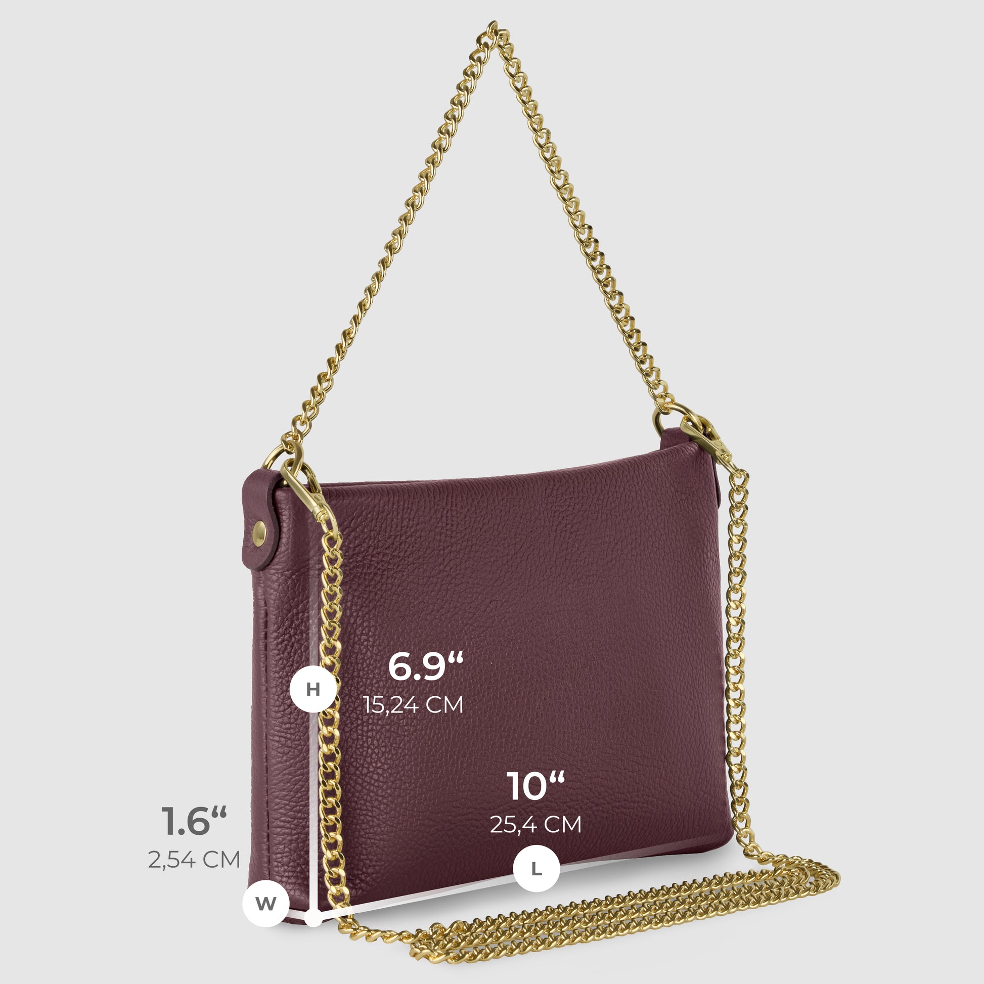 A handcrafted burgundy Italian leather crossbody purse with a gold chain strap. This elegant bag measures 10" (25.4 cm) in length, 6.9" (15.24 cm) in height, and 1.6" (2.54 cm) in width.