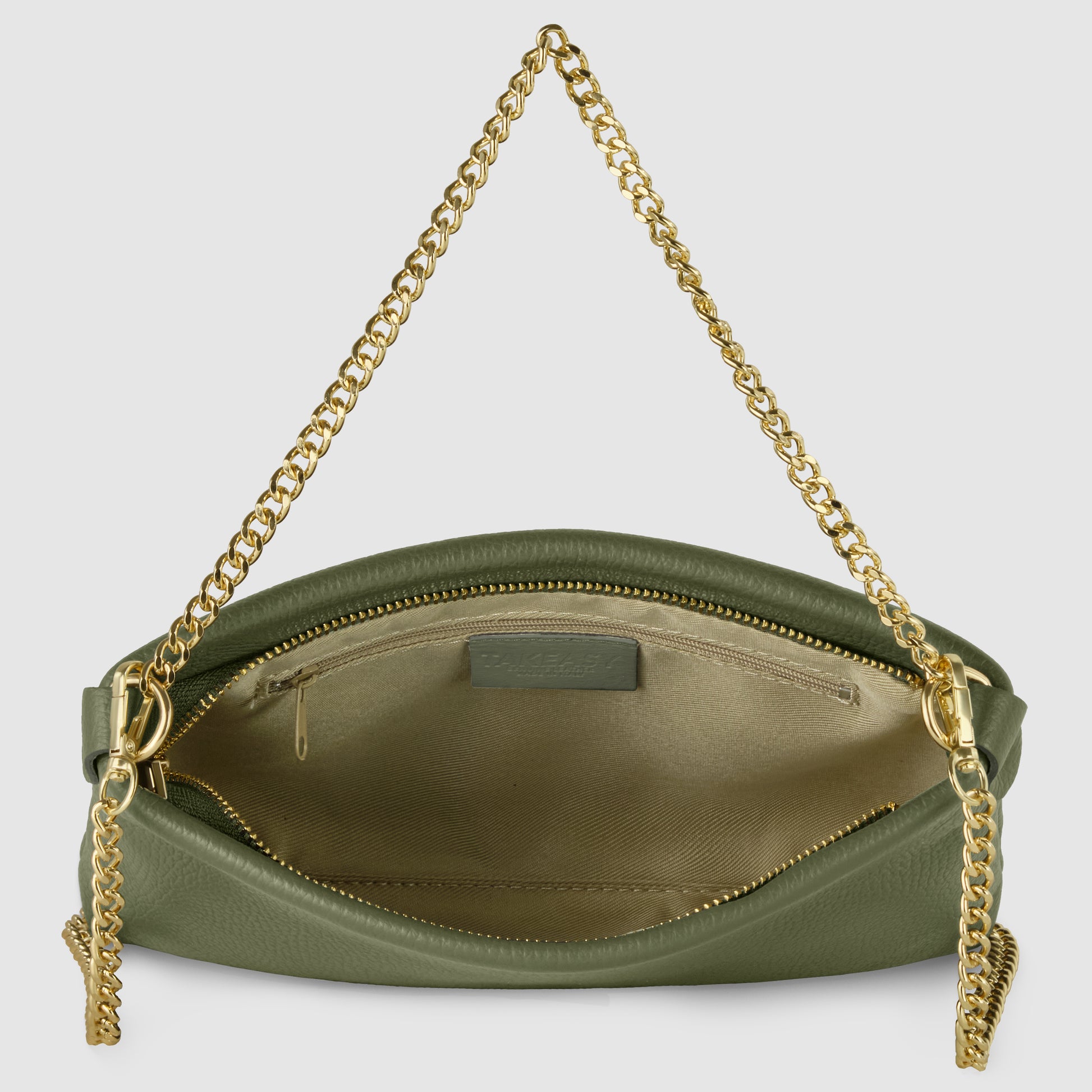 An open olive green Italian leather crossbody purse with a gold zipper and gold chain strap, revealing a beige fabric interior with a zippered pocket and a small label inside.
