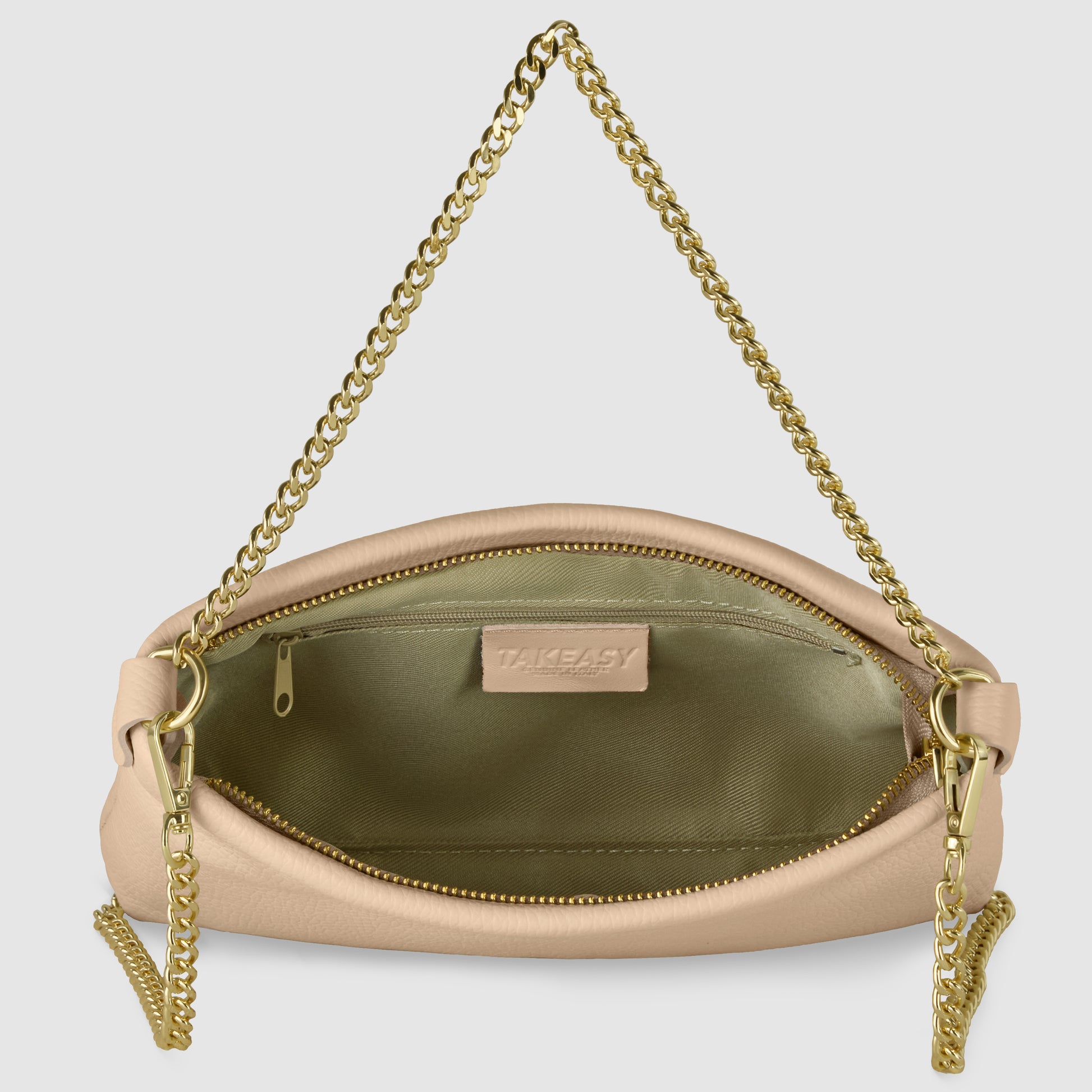 A beige Italian calf leather crossbody purse with a gold chain strap, unzipped to reveal a spacious interior lined in light green, plus an inner zip pocket and TAKEASY label—an elegant blend of luxury and versatility.