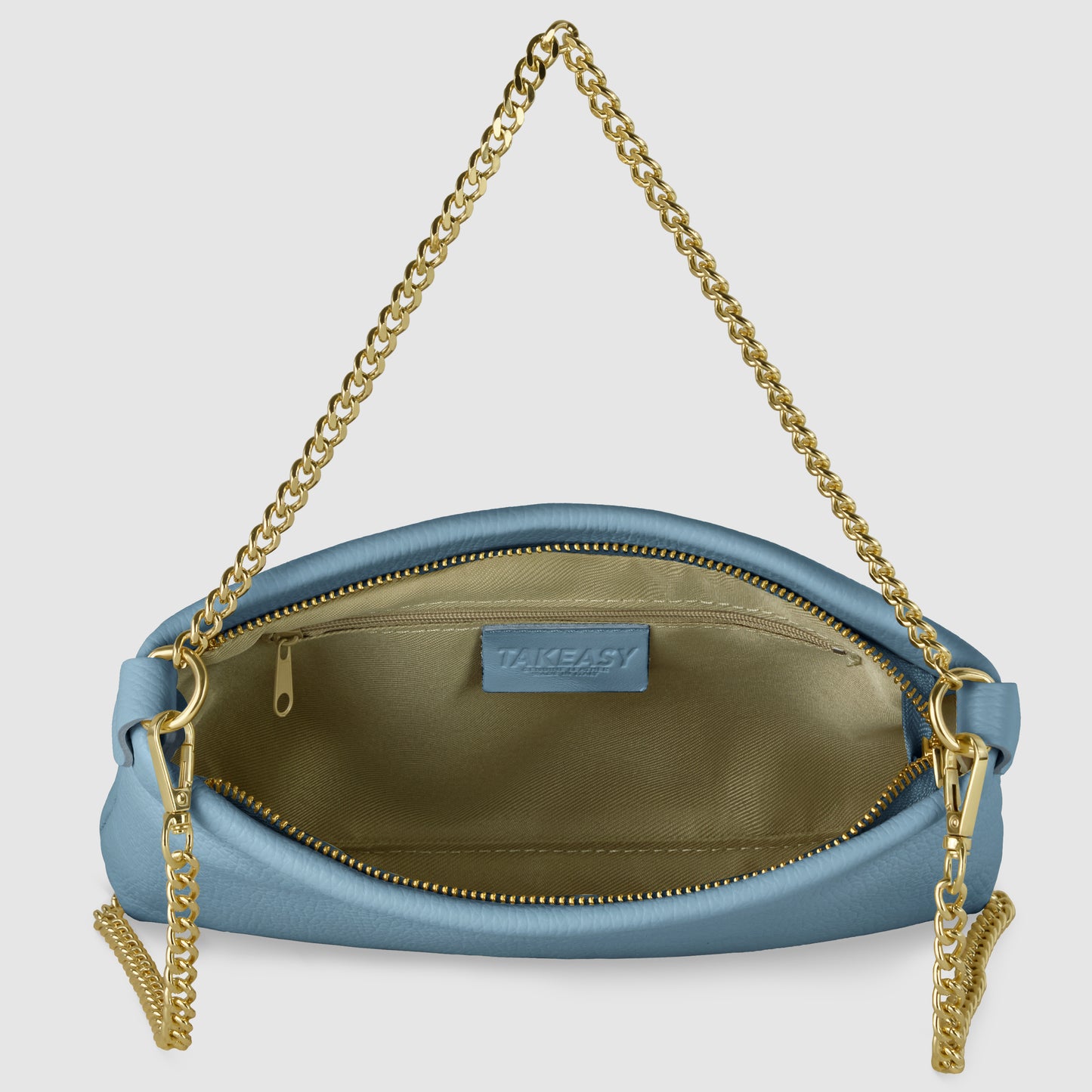 A small blue gold chain purse with a gold chain strap, open to reveal a gold-colored interior, a zippered pocket, and a TAKEASY label inside.