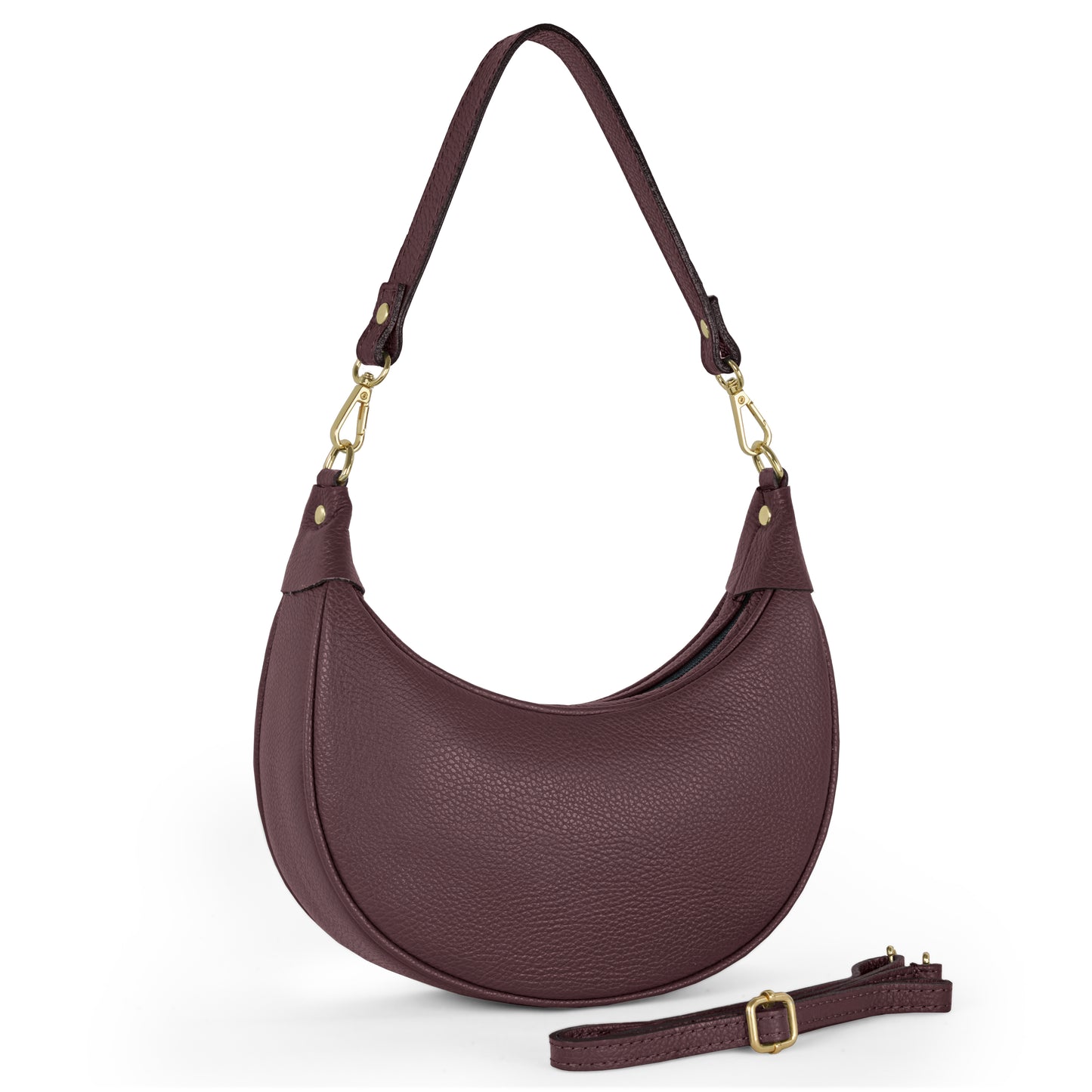 A crescent-shaped, textured burgundy handbag made from Italian calf leather with gold hardware and a detachable crossbody strap is shown on a white background, with an additional longer strap placed in front of the bag.