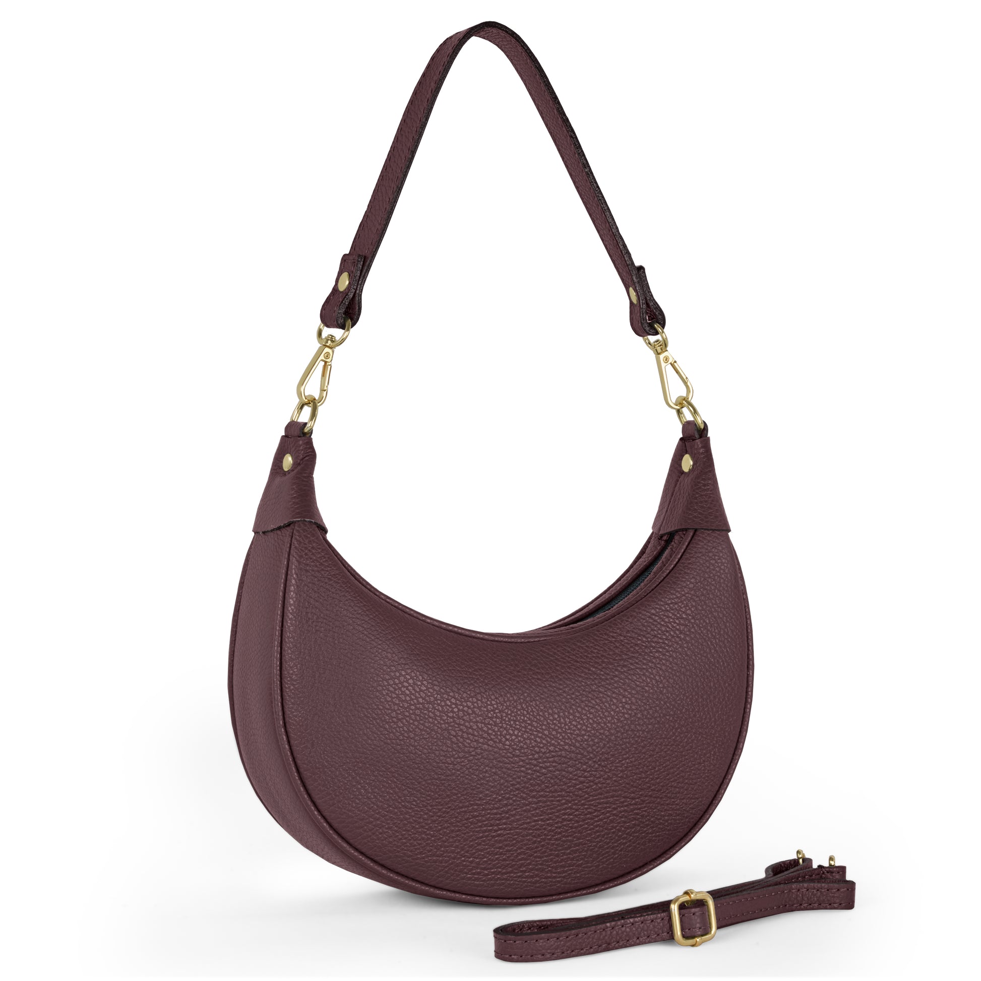 A crescent-shaped, textured burgundy handbag made from Italian calf leather with gold hardware and a detachable crossbody strap is shown on a white background, with an additional longer strap placed in front of the bag.