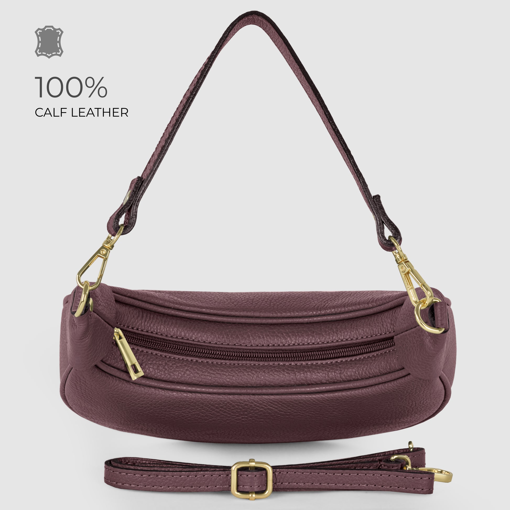 A maroon Italian calf leather crescent-shaped handbag with gold hardware, detachable shoulder strap, and zippered front pocket. Text reads 100% CALF LEATHER. Bag is displayed on a light grey background.