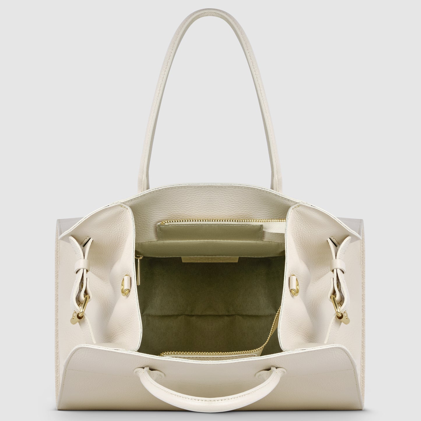 An open white Italian leather bag with gold hardware, showing the spacious interior, a central zippered pocket, and two open side compartments. The structured bag has two top handles and reflects classic Florentine leatherwork.