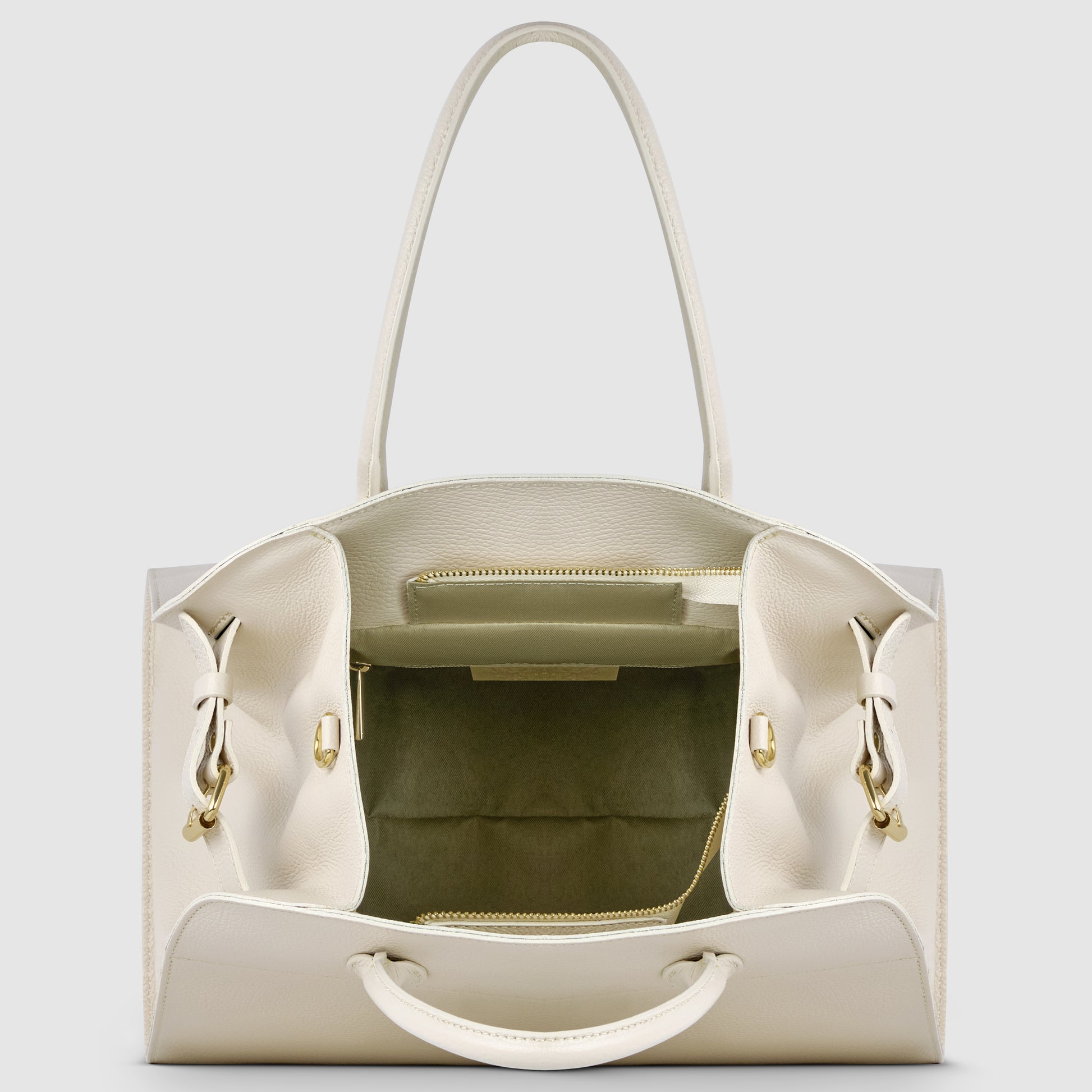 An open white Italian leather bag with gold hardware, showing the spacious interior, a central zippered pocket, and two open side compartments. The structured bag has two top handles and reflects classic Florentine leatherwork.