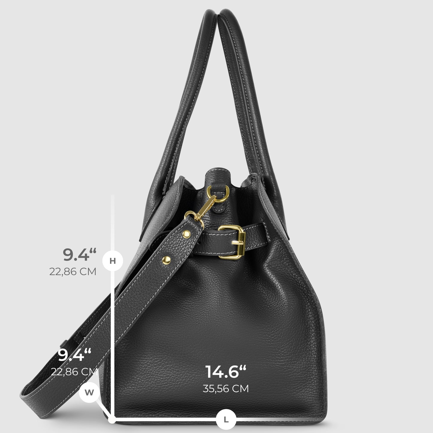 A black Italian leather bag with gold hardware is shown upright. Dimensions are marked: height and width are both 9.4 inches (22.86 cm), and length is 14.6 inches (35.56 cm). A modern take on classic Florentine leatherwork.