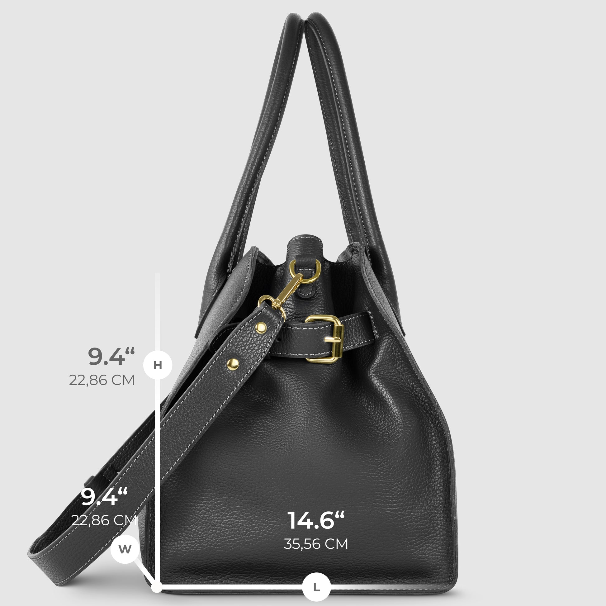 A black Italian leather bag with gold hardware is shown upright. Dimensions are marked: height and width are both 9.4 inches (22.86 cm), and length is 14.6 inches (35.56 cm). A modern take on classic Florentine leatherwork.