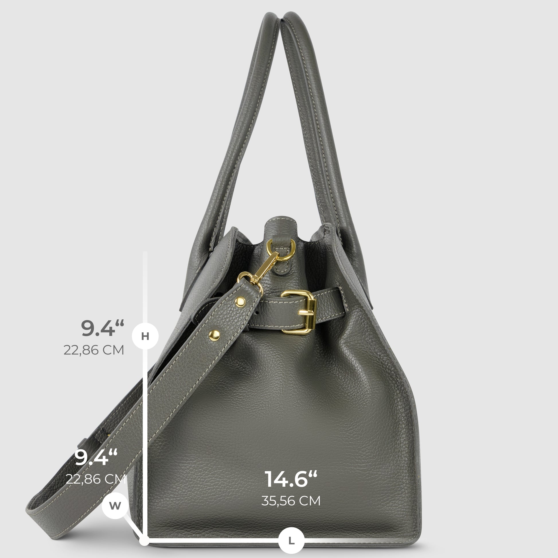 A gray Italian leather bag with gold hardware is shown upright. Featuring a shoulder strap and two handles, this piece of Florentine leatherwork has labeled dimensions: height 9.4" (22.86 cm), width 9.4", and length 14.6" (35.56 cm).