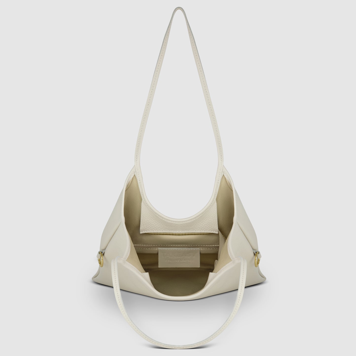 A cream-colored Italian leather bag with two shoulder straps, shown open to reveal a spacious interior, an inner zip pocket, and gold button details—an ideal everyday shoulder bag crafted with timeless Florentine craftsmanship.