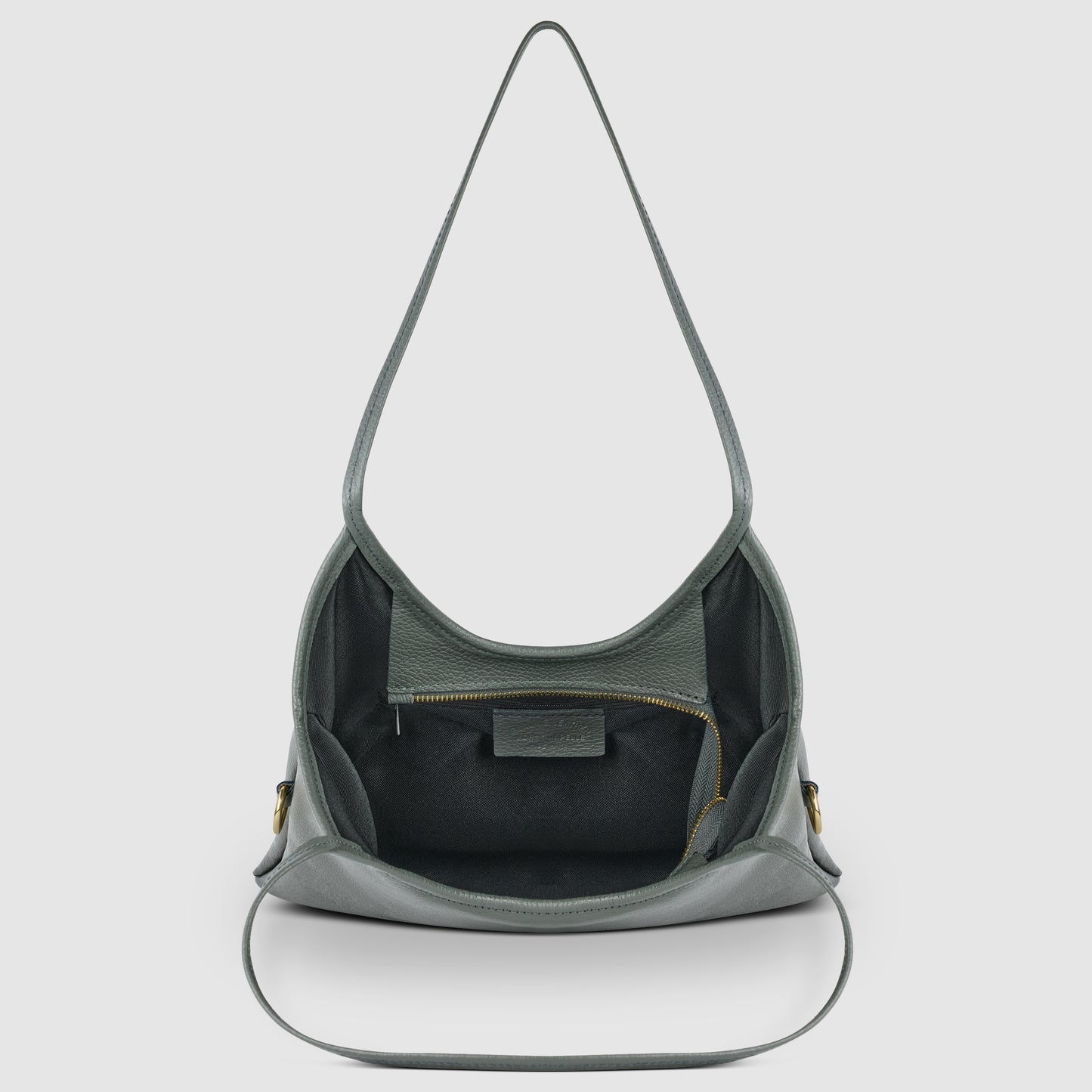 A gray Italian leather shoulder bag with a wide strap, open to reveal a spacious interior, an inner zippered pocket, and a leather patch—all showcasing Florentine craftsmanship against a plain white background.