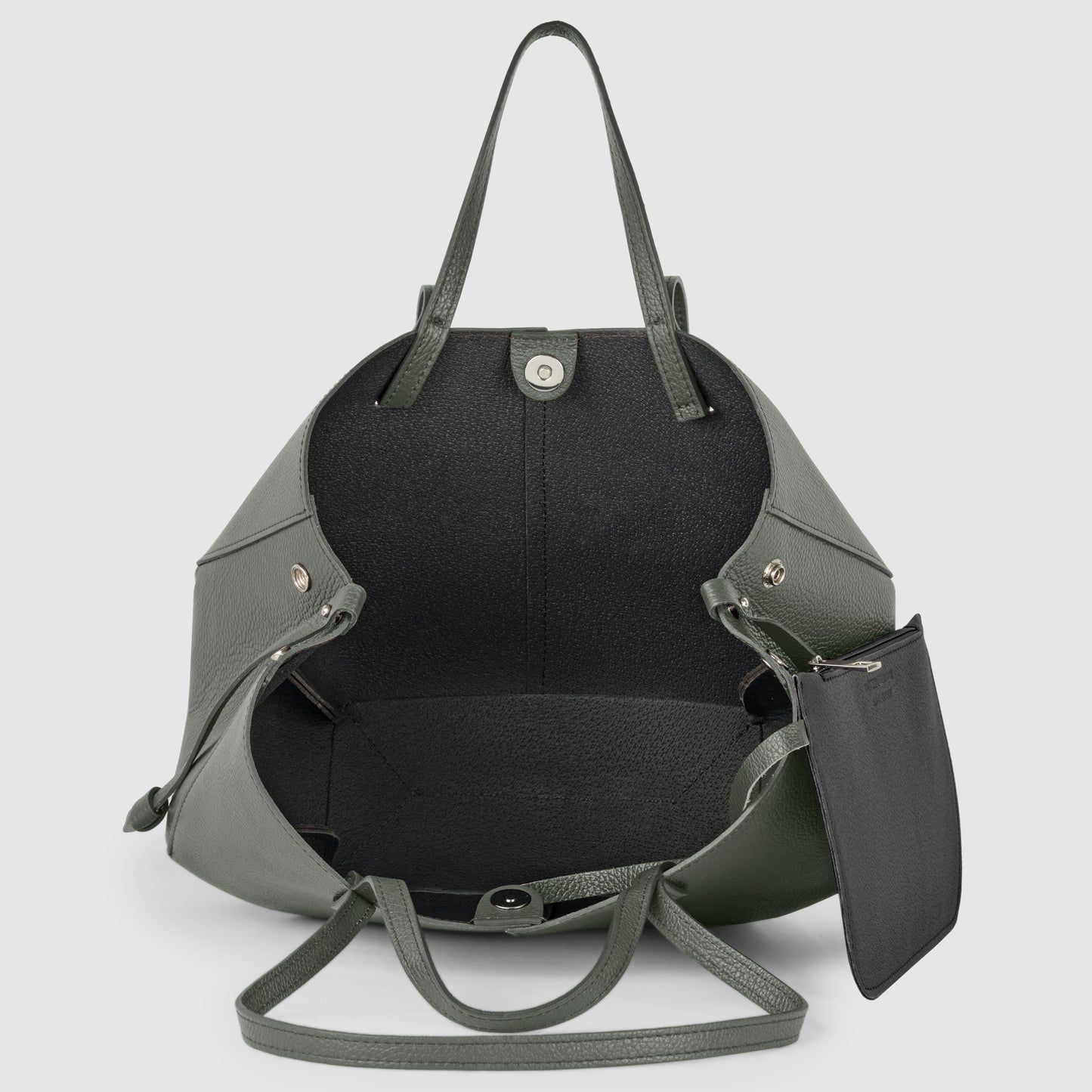 A large, open, dark green Italian leather handbag with two handles, silver hardware, a snap closure, and a detachable black zip pouch inside, handcrafted in Italy and shown on a light gray background.