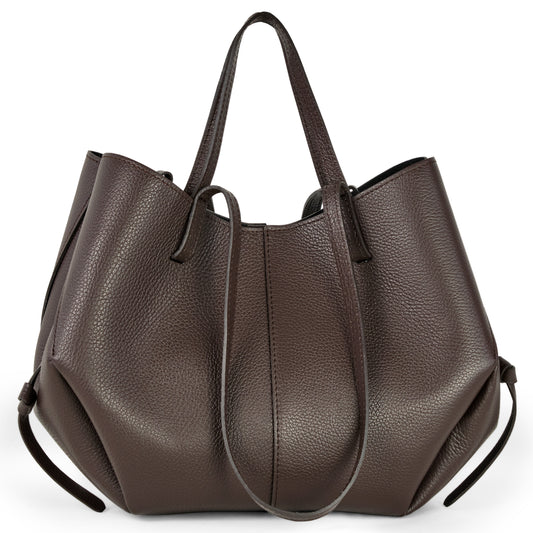 A large, handcrafted Italian leather handbag in brown with two top handles, side drawstrings, and a pebbled texture, displayed against a white background.