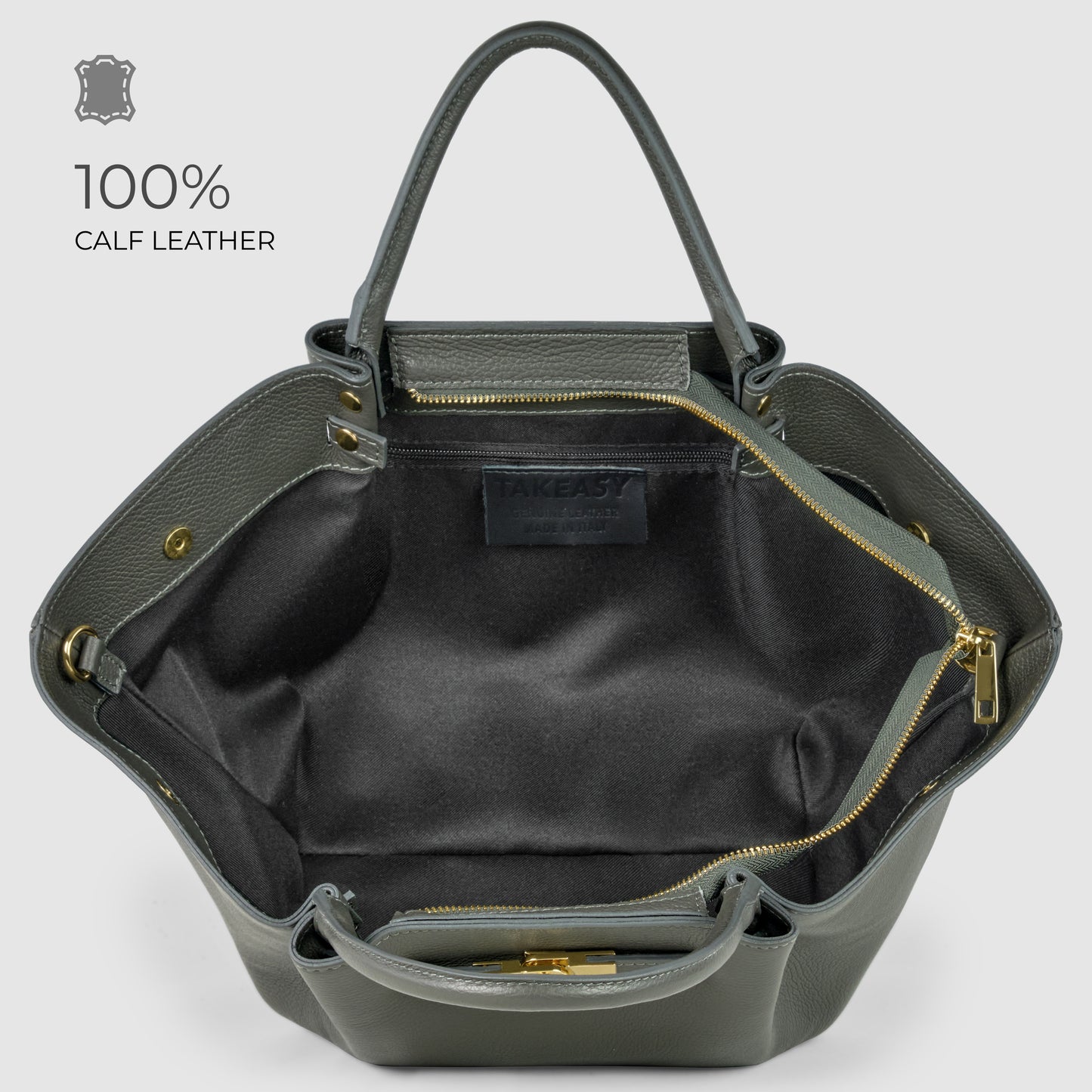 Open gray women's handbag made of 100% Italian leather, showing a spacious black fabric-lined interior with multiple compartments and gold zipper details. The brand label TAKEAST is visible inside, reflecting exquisite Florentine craftsmanship.