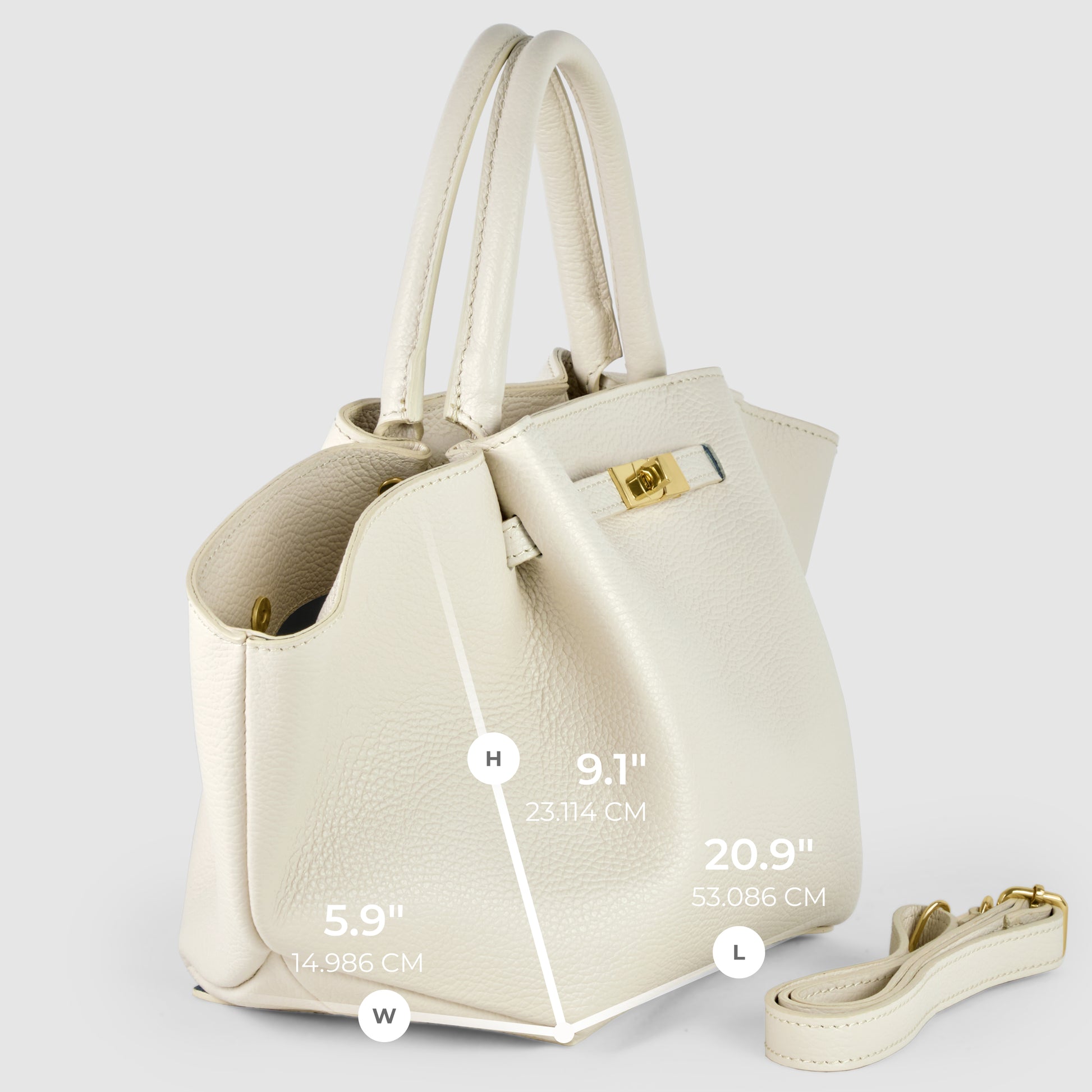 A cream-colored Italian leather bag with gold hardware is shown at an angle. Dimensions are marked: Height 9.1 (23.114 cm), Width 5.9 (14.986 cm), Length 20.9 (53.086 cm). A matching shoulder strap lies beside this women's handbag.