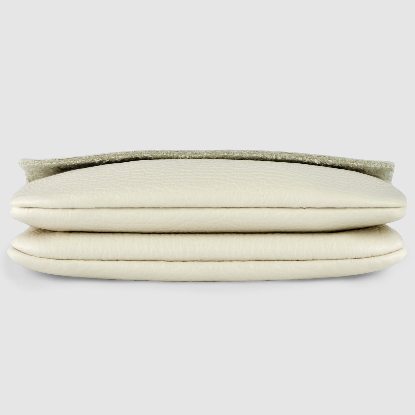 A close-up view of a folded, cream-colored Italian leather wallet with a textured surface, shown from the side on a plain light gray background.