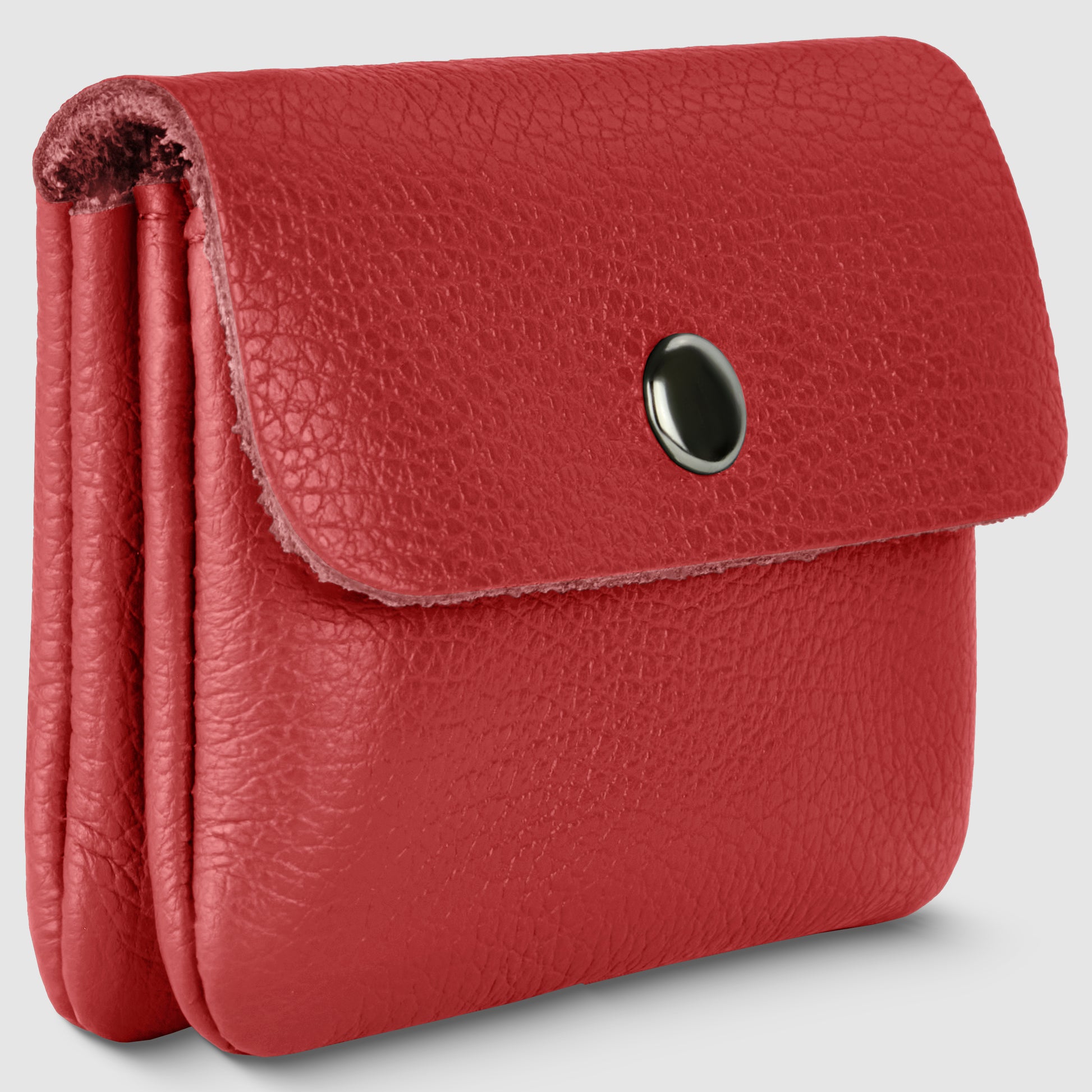 A small, textured red Italian leather wallet with a flap closure secured by a black snap button, shown on a plain, light gray background—perfect for minimalism wallet lovers.
