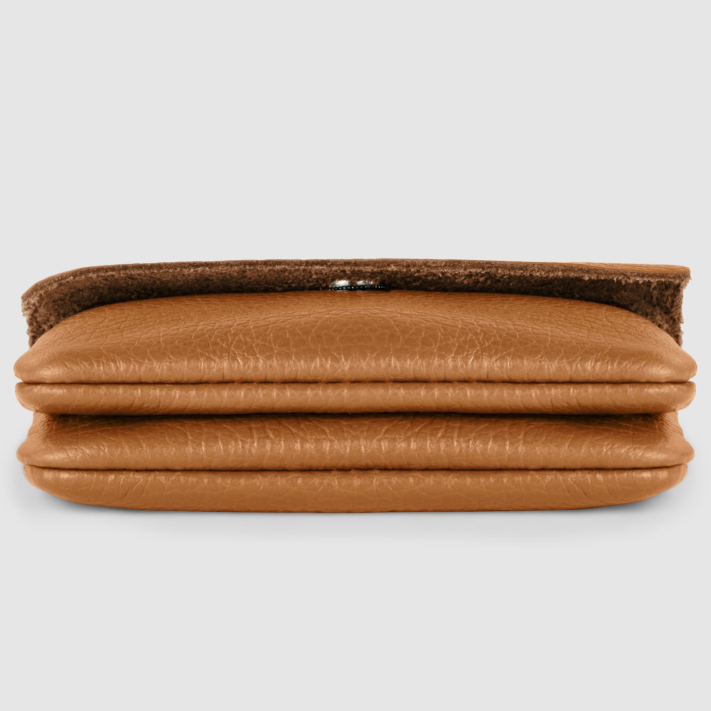 A brown Italian leather wallet with a textured surface, shown from the side with its flap open, displays its layered, folded design on a plain light background.