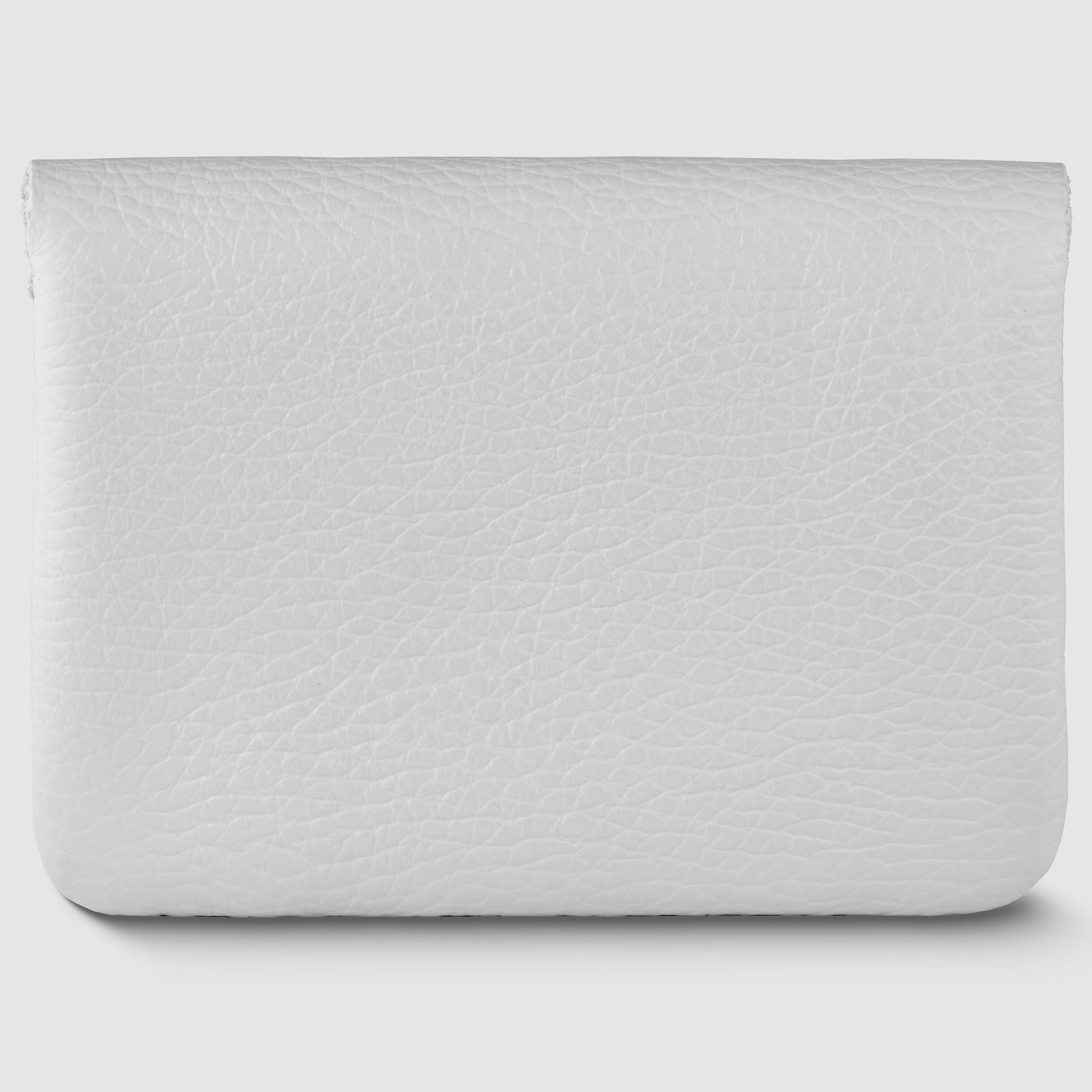 A rectangular, white handmade wallet in textured leather with a flap closure, reflecting Italian minimalism, photographed against a light grey background.