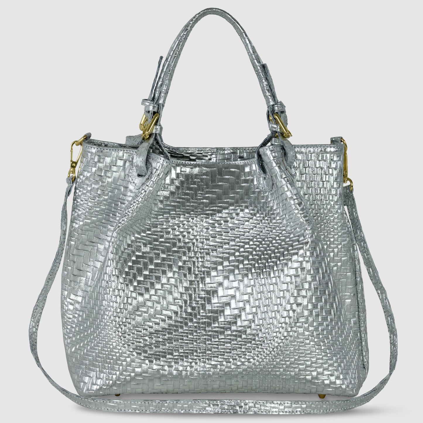 A women’s designer handbag in Grid Metallic Silver, featuring two short handles, a detachable shoulder strap, and gold hardware, displayed against a plain light background.