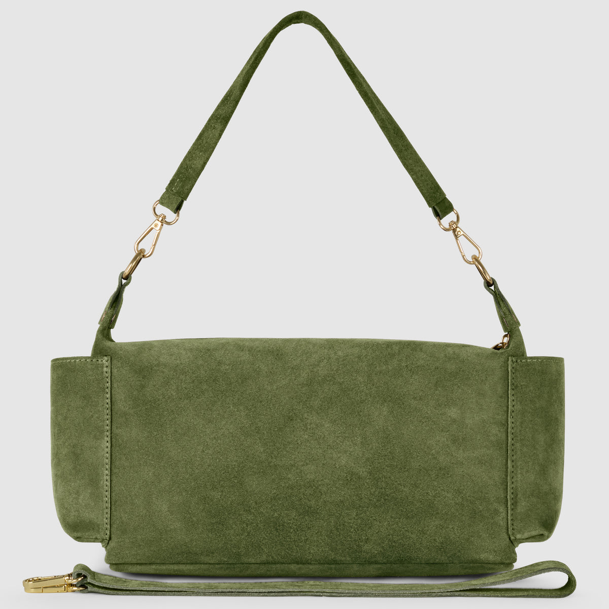 A green suede leather handbag, handmade in Italy with a detachable shoulder strap and gold-tone hardware, is displayed on a plain light background.