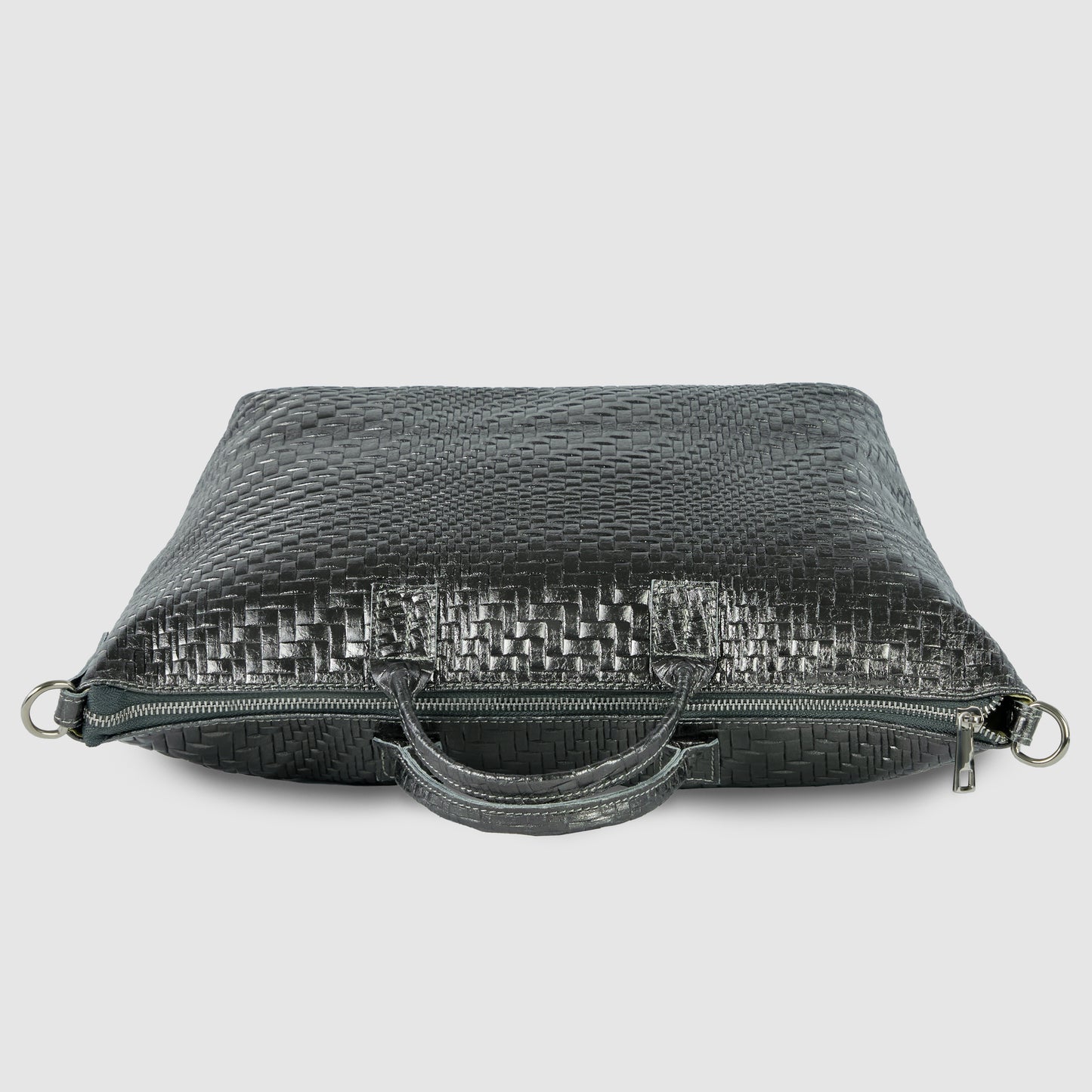 A sleek black grid-embossed purse with a woven pattern, zipper closure, and two handles, crafted from textured leather and shown lying flat on a light gray background.