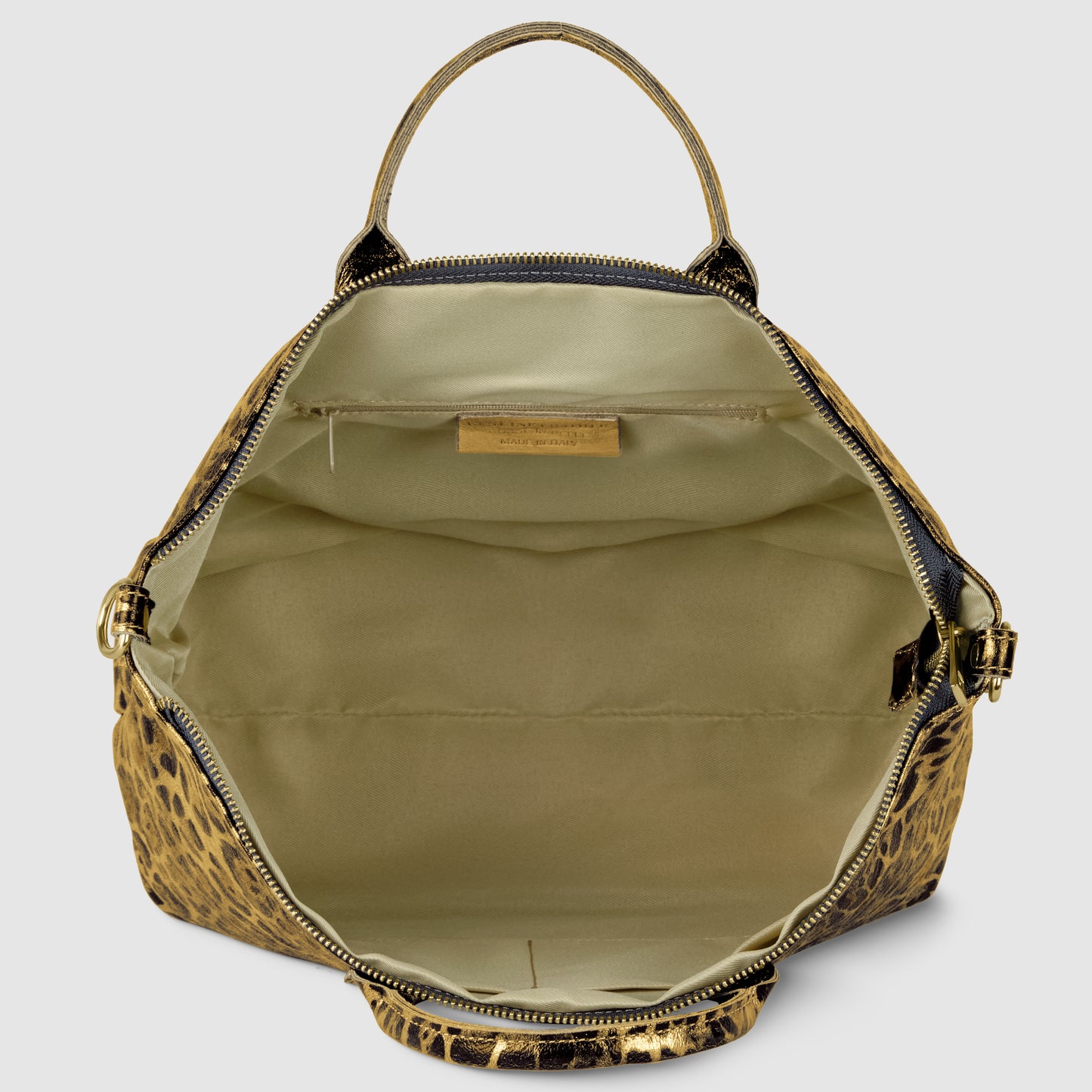 Open, metallic leopard print TAKEASY handbag with tan interior, featuring a fabric lining, inner pocket, and gold label inside. The bag has a top handle and gold zipper, set against a plain background.
