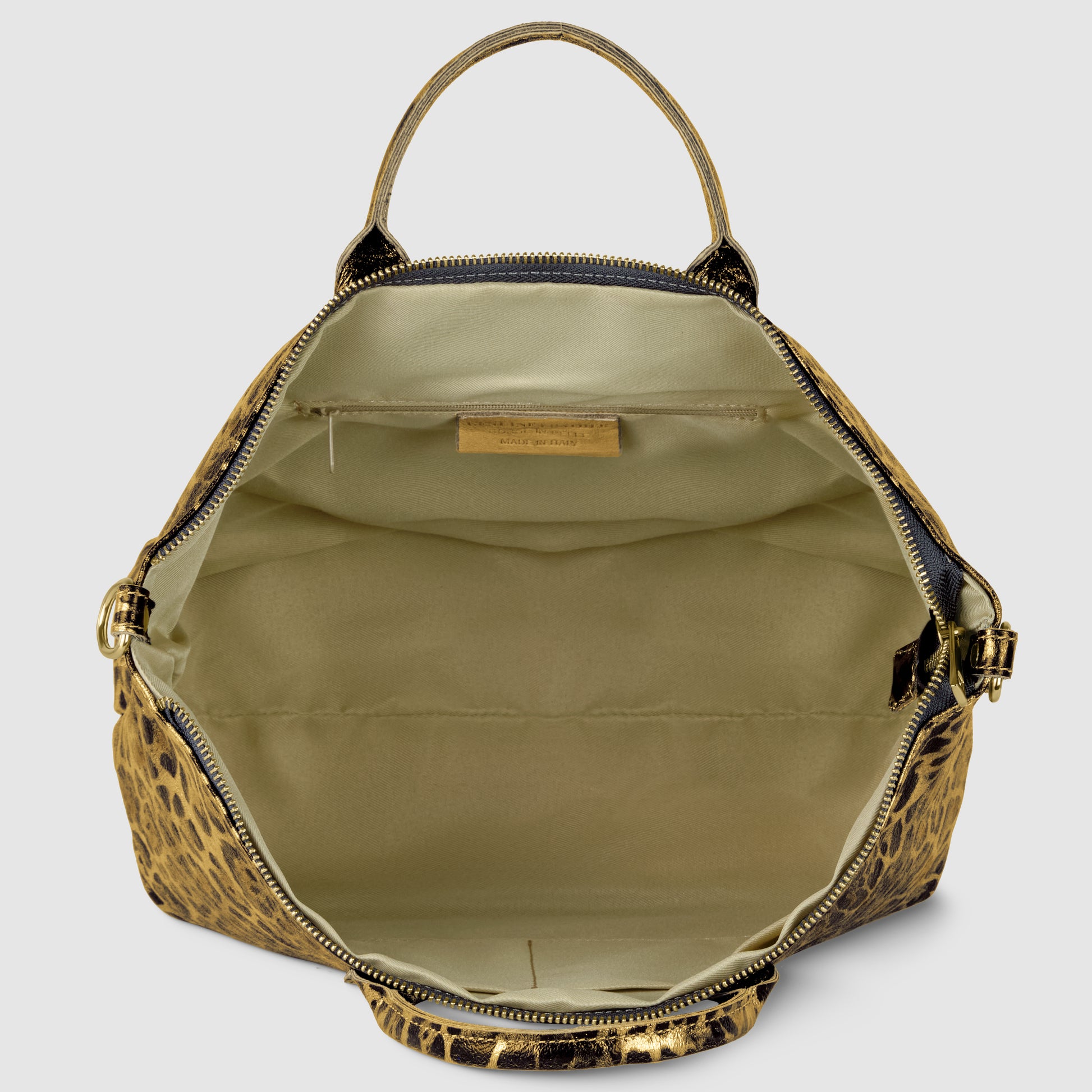 Open, metallic leopard print TAKEASY handbag with tan interior, featuring a fabric lining, inner pocket, and gold label inside. The bag has a top handle and gold zipper, set against a plain background.