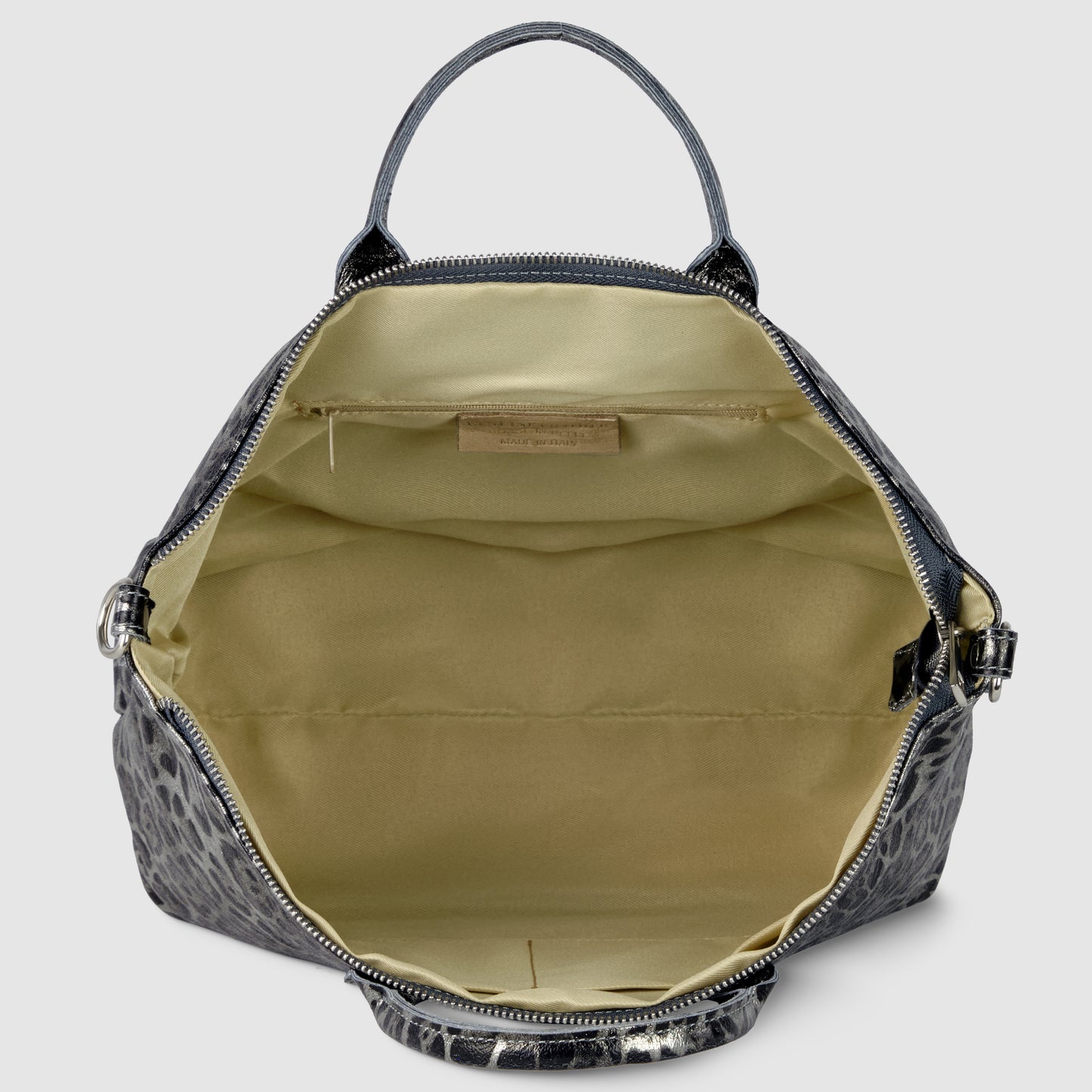 Open view of a TAKEASY metallic leopard print handbag with a single top handle, showing a spacious beige interior with a small pocket and label sewn inside.