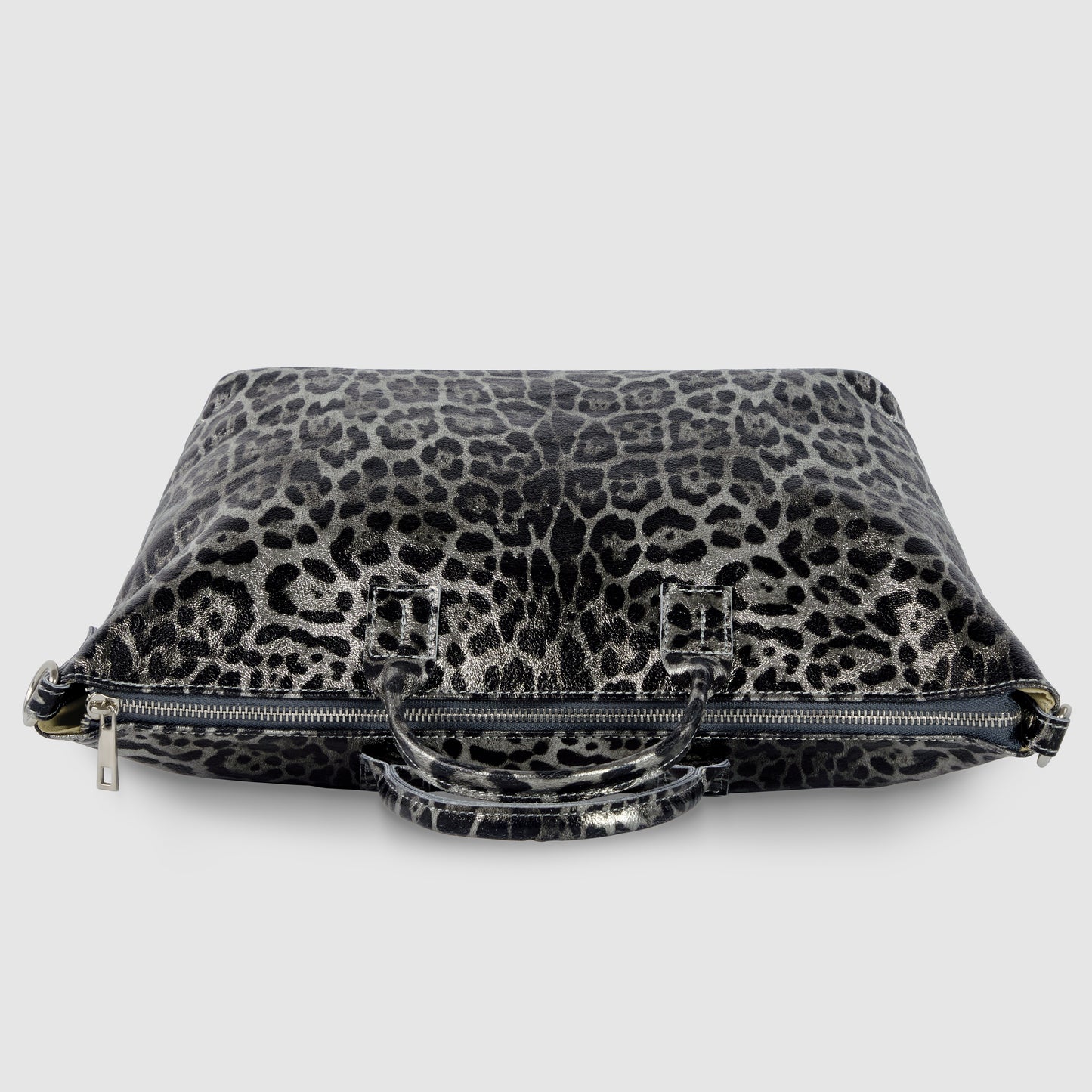 A rectangular metallic leopard print handbag with short handles and a visible zipper, placed on a white background.