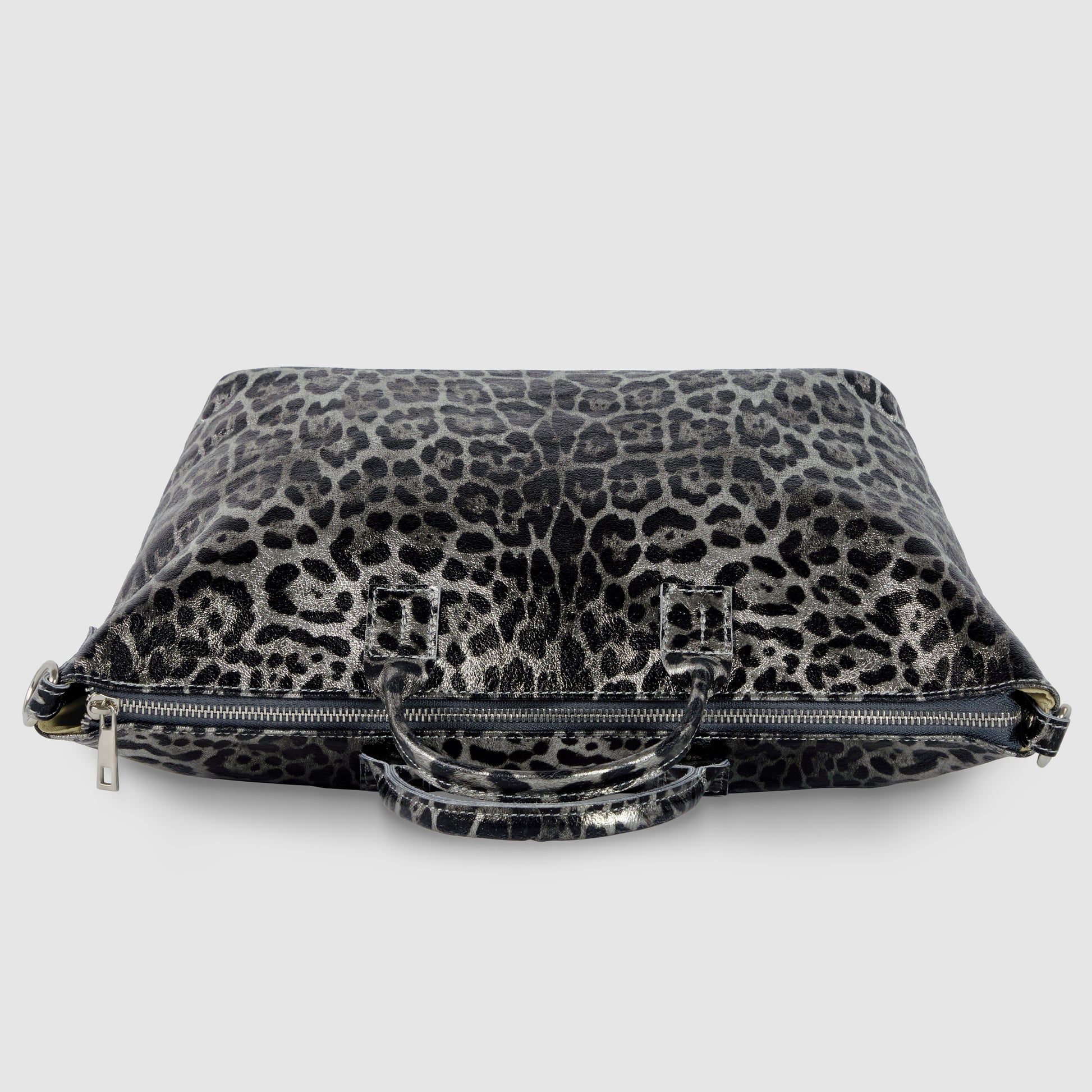 A rectangular metallic leopard print handbag with short handles and a visible zipper, placed on a white background.