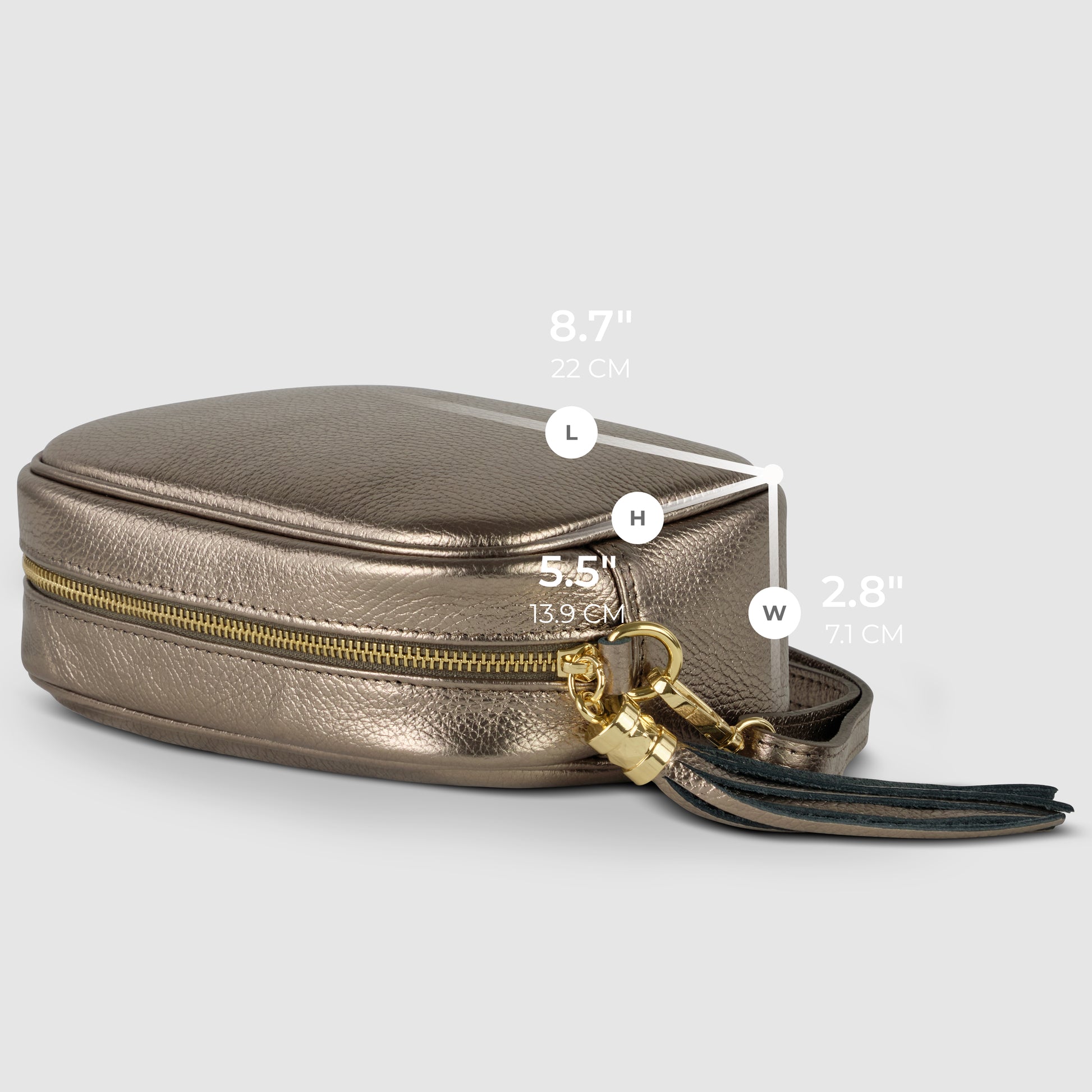 A small rectangular purse in metallic gold calf leather with a zipper and tassel, displayed on its side with dimensions labeled: 8.7 (L), 5.5 (H), and 2.8 (W).