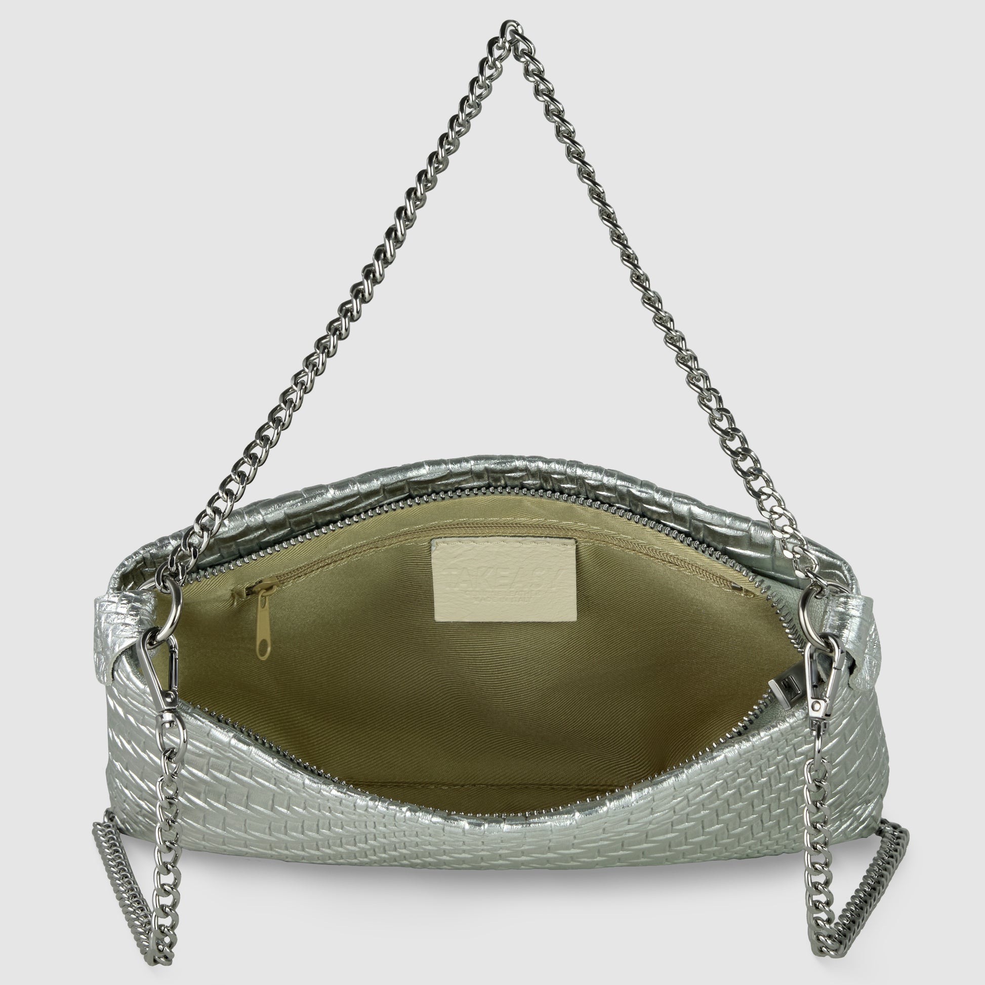 A metallic-woven leather bag with a chain strap is open, revealing a light beige interior and a small zippered pocket on one side—a stunning example of Italian handcrafted handbag artistry.