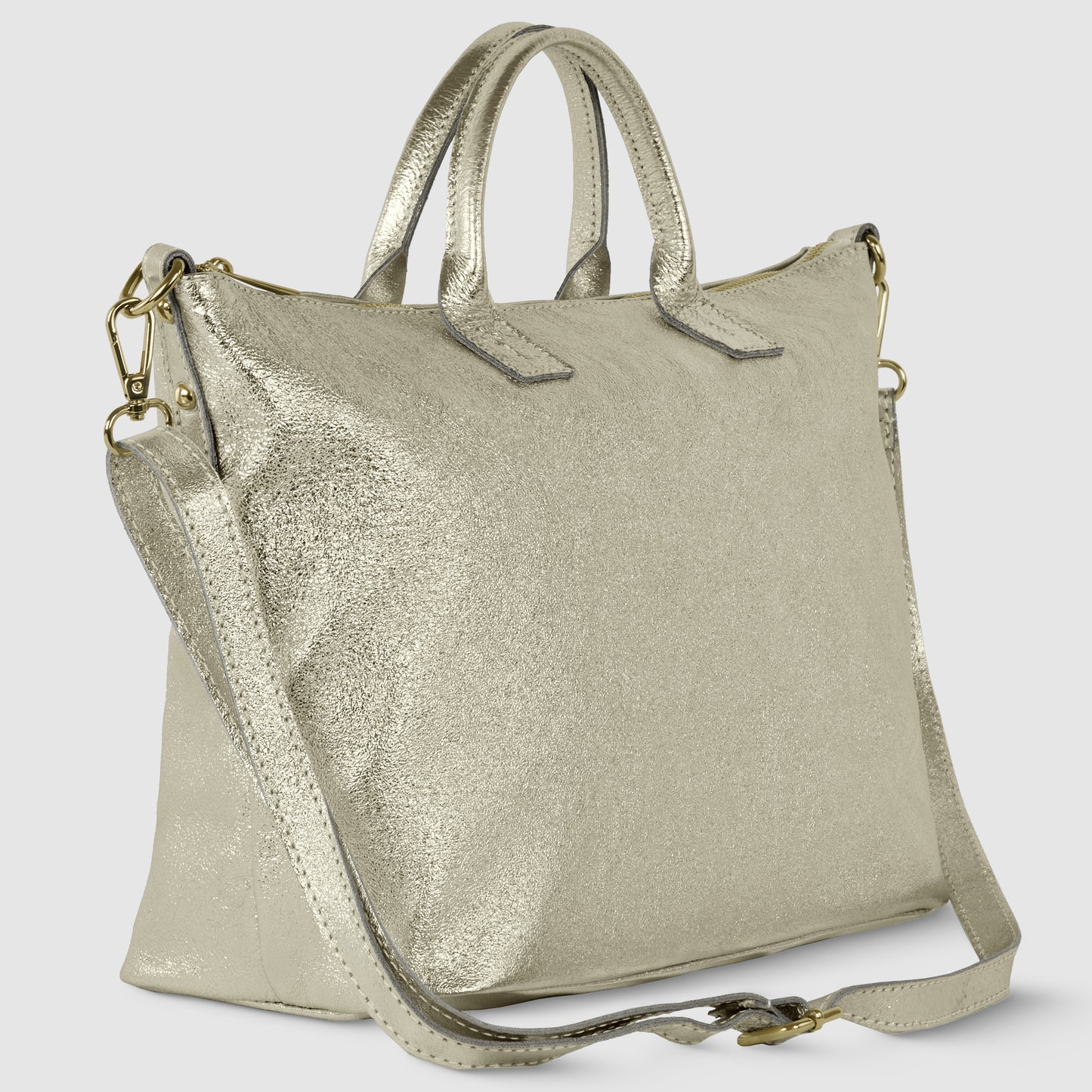 A metallic gold Italian handbag with dual top handles and a detachable shoulder strap. This geometric leather bag features a textured finish and gold-tone hardware, photographed against a plain light background.