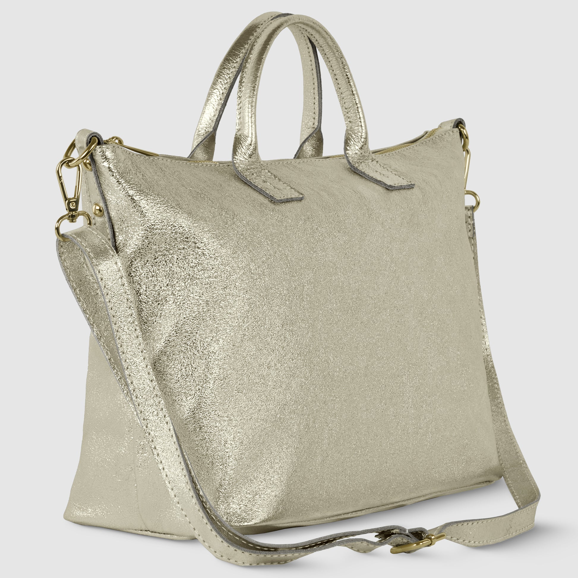 A metallic gold Italian handbag with dual top handles and a detachable shoulder strap. This geometric leather bag features a textured finish and gold-tone hardware, photographed against a plain light background.