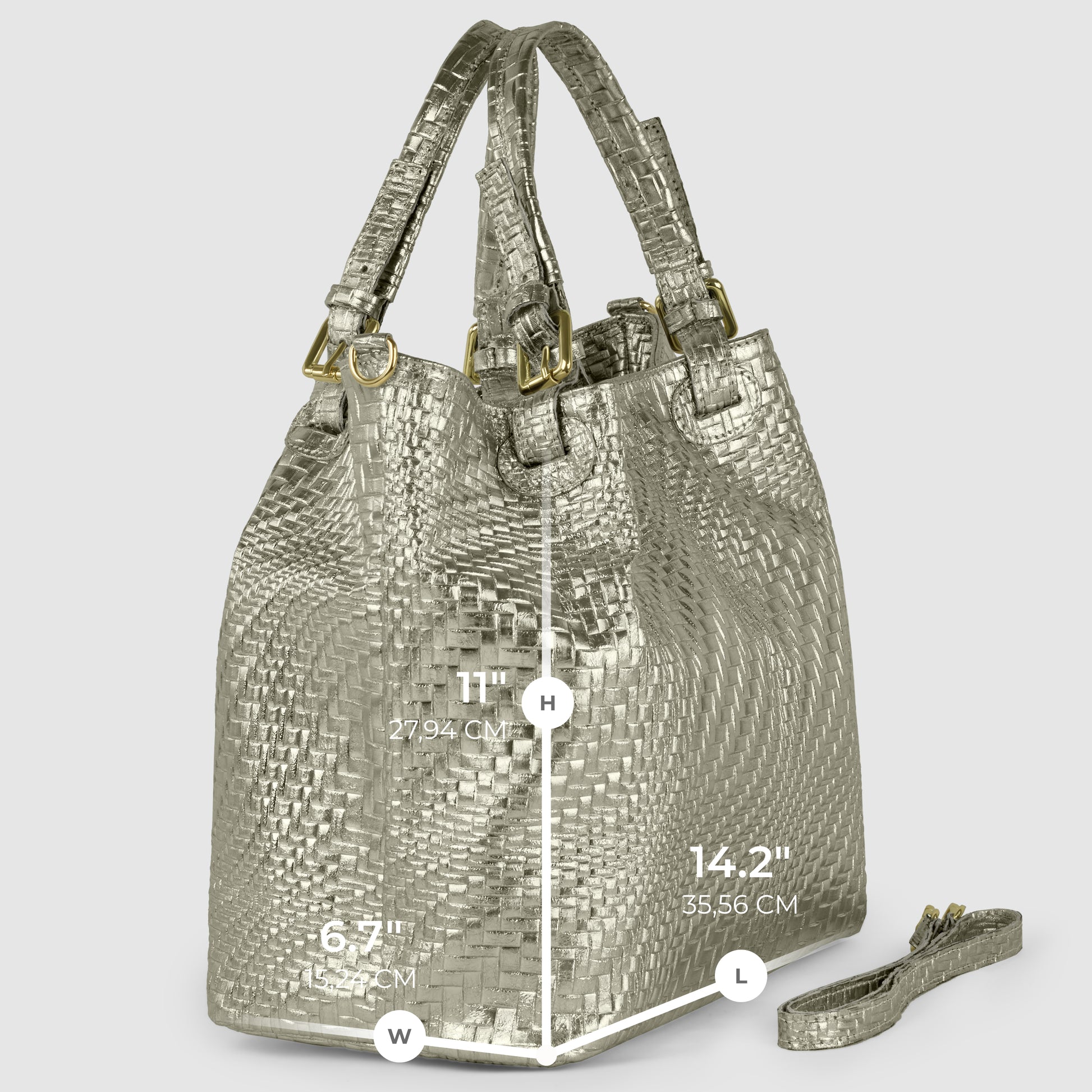 A metallic woven handcrafted designer bag stands upright, with dimensions labeled: height 11 (27.94 cm), width 6.7 (17.01 cm), and length 14.2 (35.56 cm). A matching detachable strap lies beside the bag.