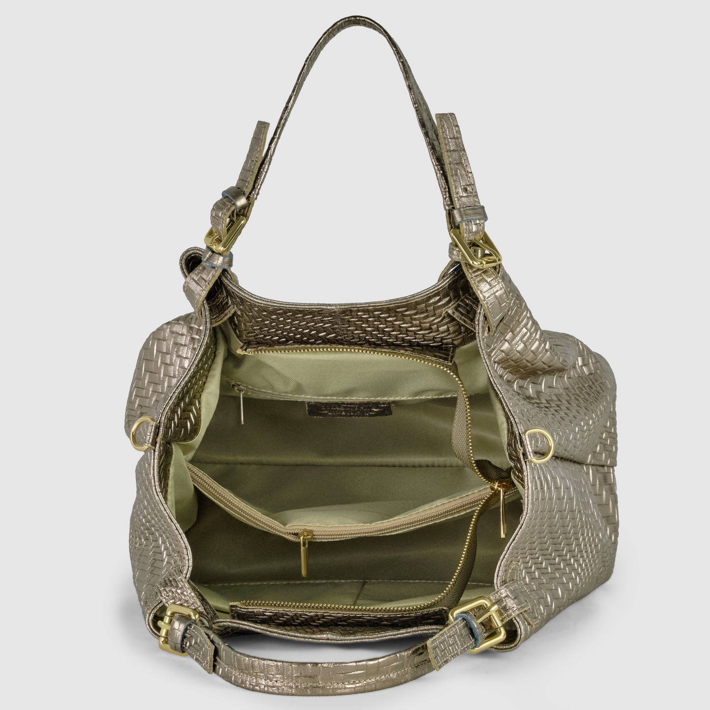 A metallic woven women's designer bag with gold hardware is shown open, revealing multiple interior compartments with zippers and pockets, two sturdy handles, and light olive green lining.