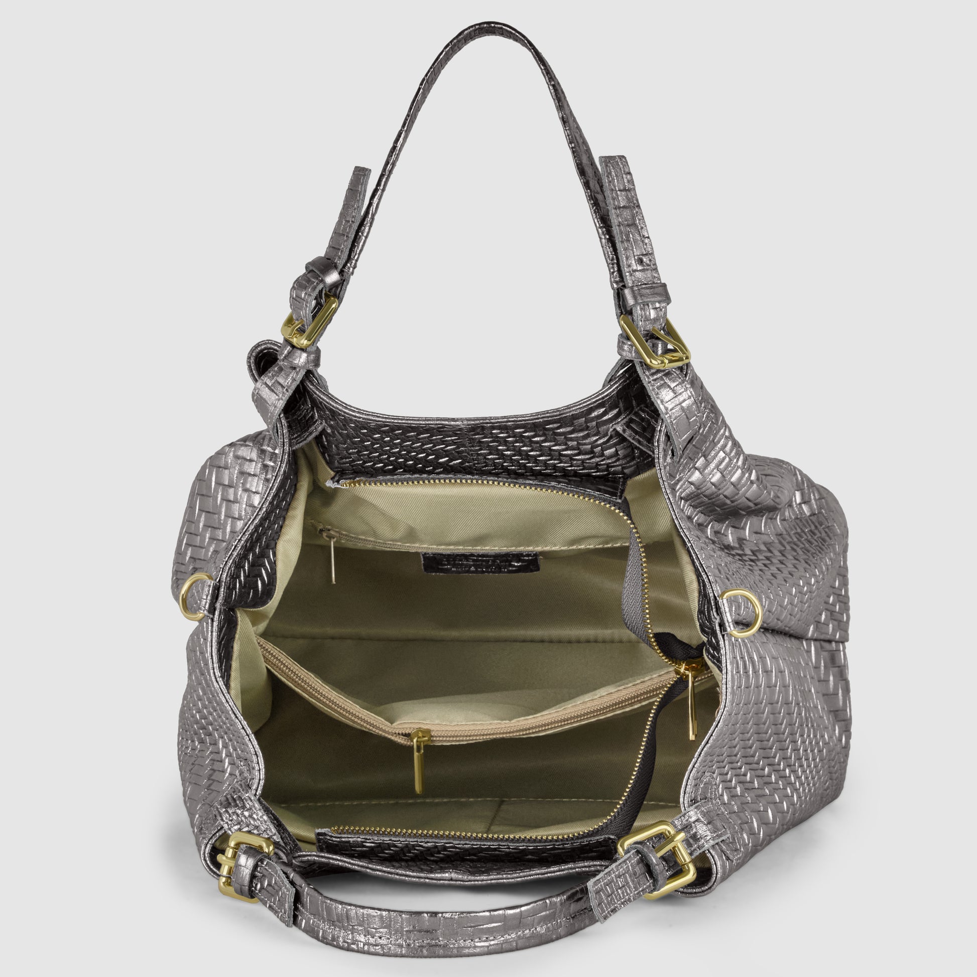 A silver Italian leather handbag with the main compartment open, showing beige fabric lining, multiple interior pockets, and gold-tone zipper and hardware details.